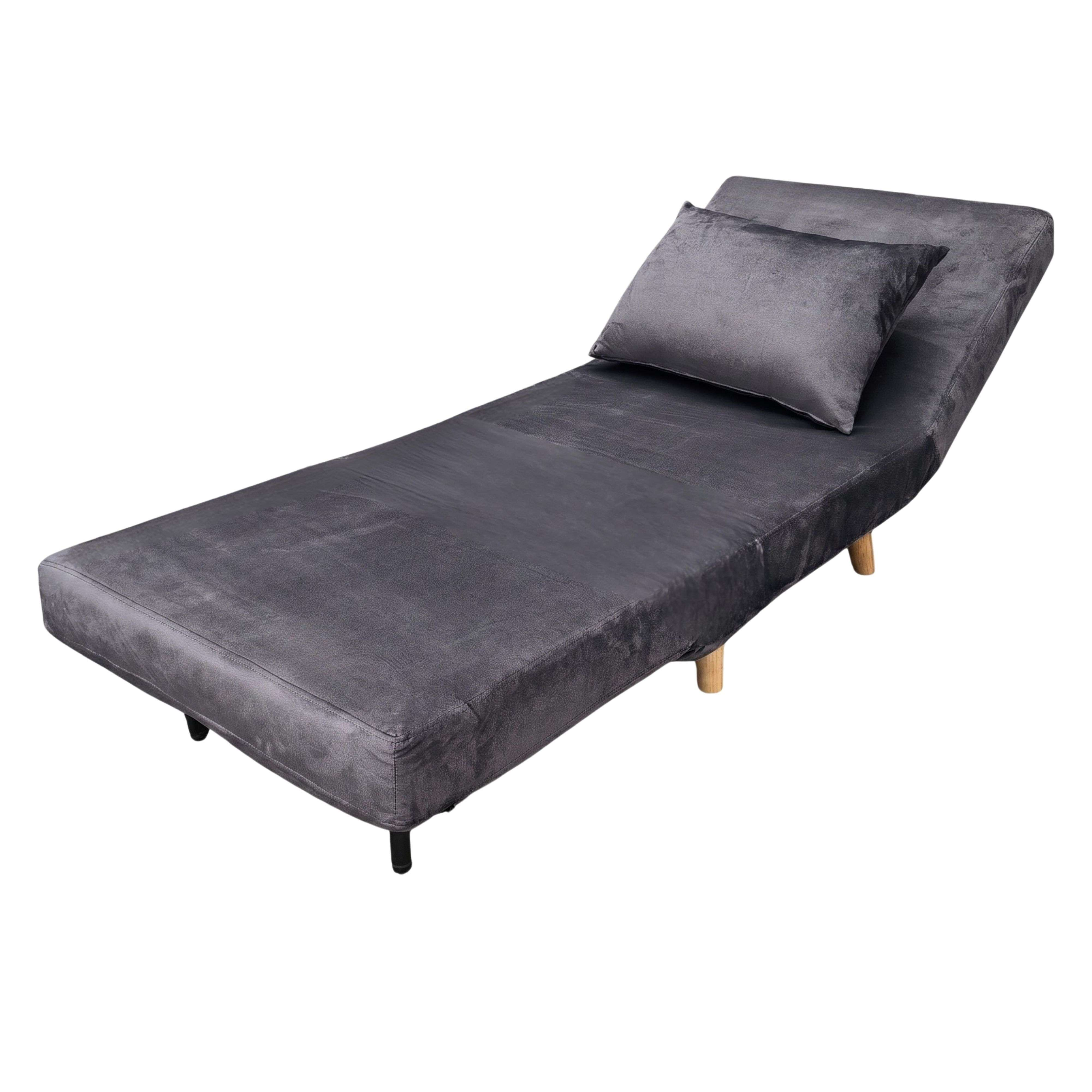 Un sofá cama gris con un cojín, sobre patas blancas.
