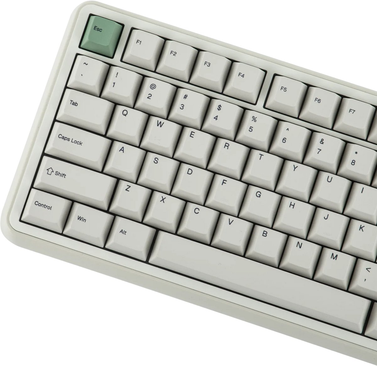 Un clavier blanc avec une touche Échap verte et des touches argentées.