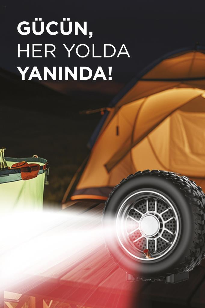 Ön planda soğutucu ve ışıklı lastik bulunan şişme çadır.