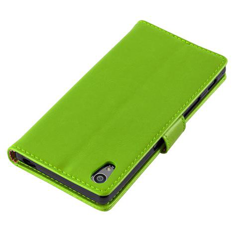 Custodia verde a libro per telefono con foro fotocamera e cinturino.