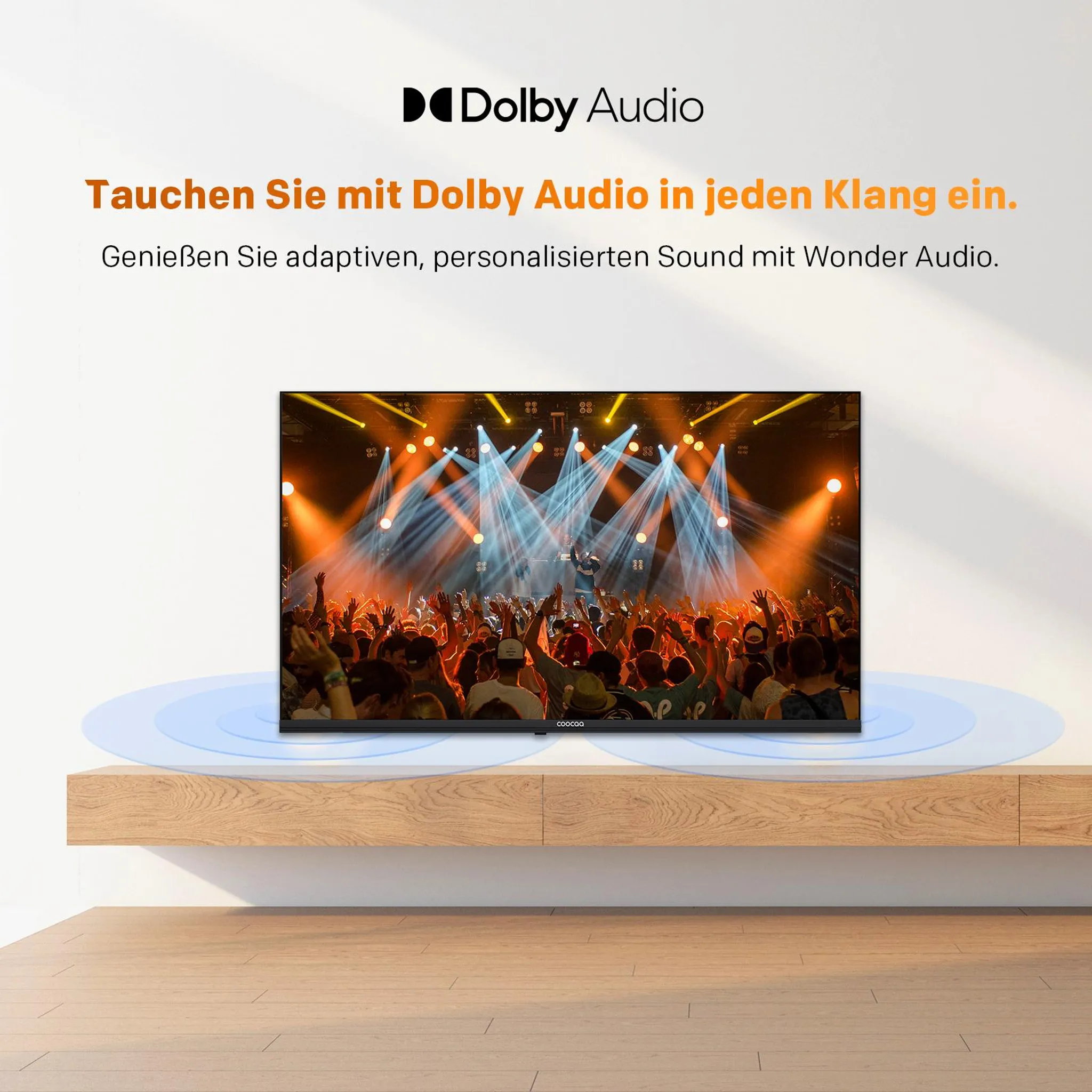 Un televisor muestra un concierto con luces y una multitud animada.