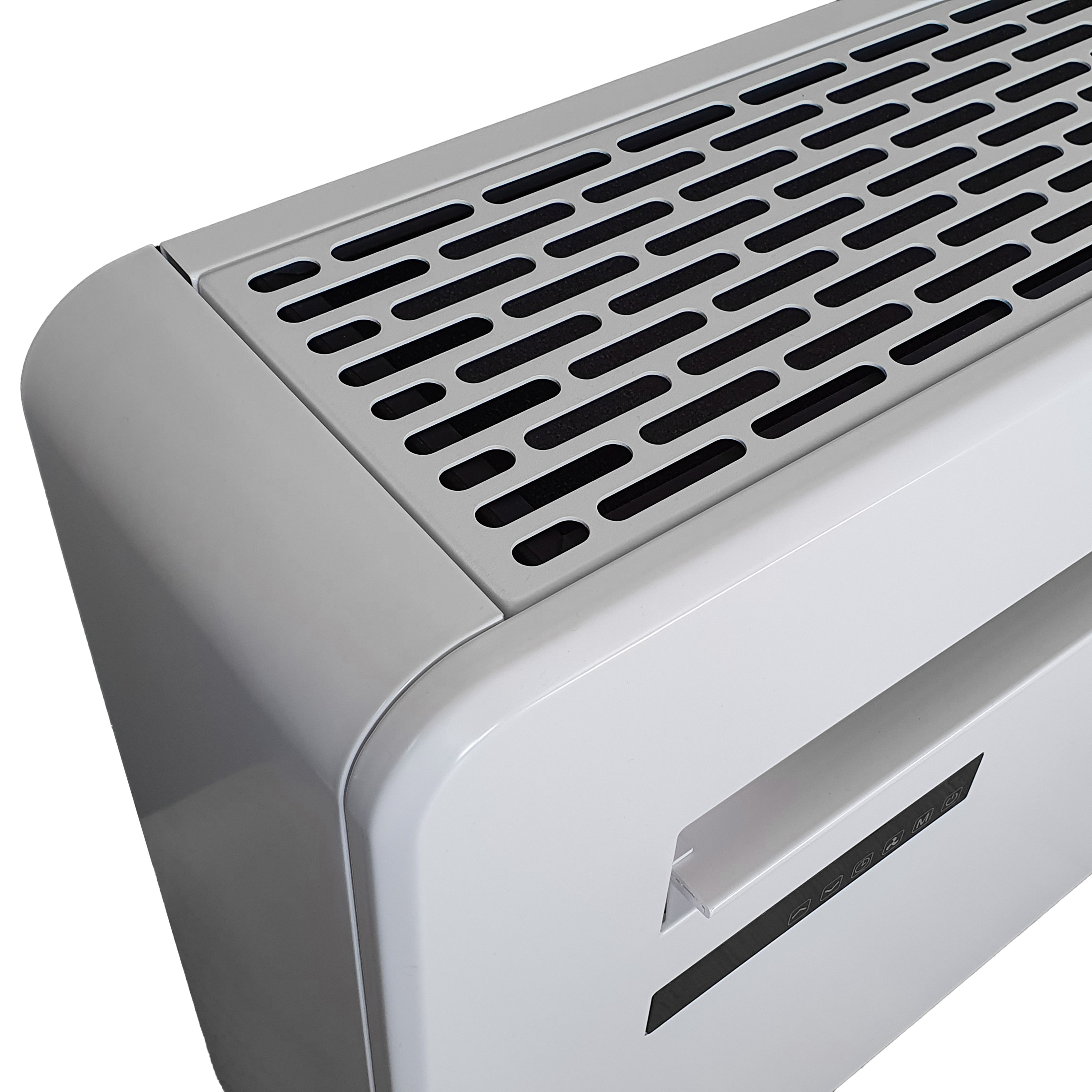 Een grijze ventilatieopening met een rooster op een wit apparaat.