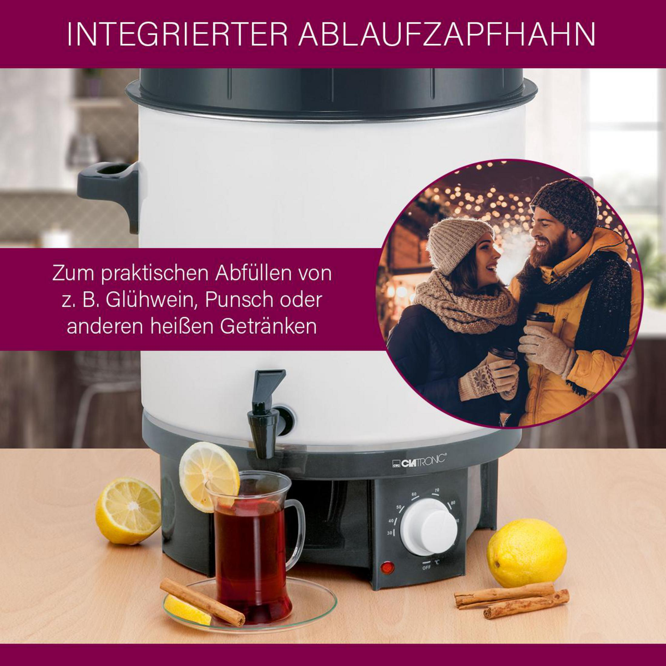 Ein Heißgetränke-Spender mit Zapfhahn, Zitrone, Zimt und einem Paar.