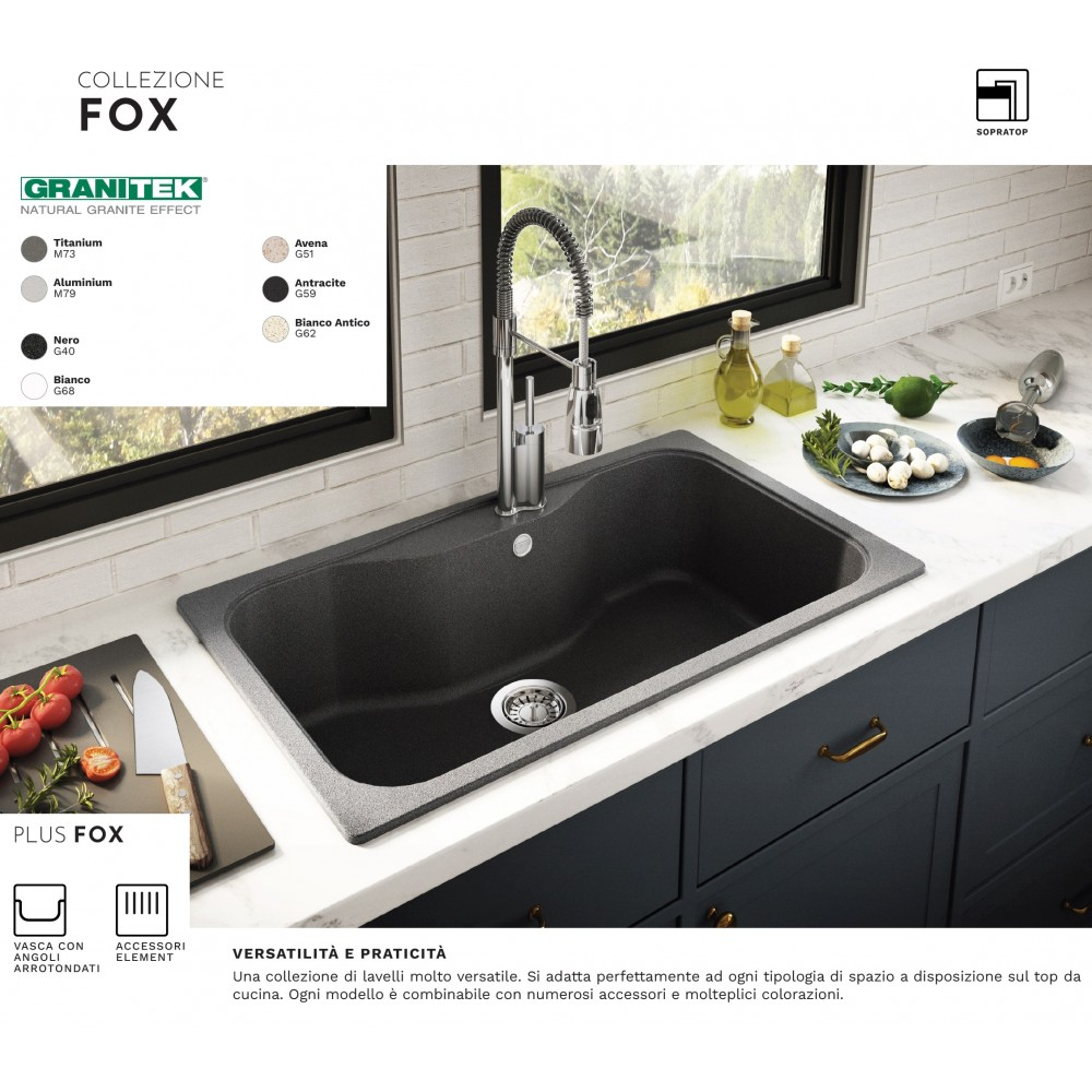 Lavello grigio scuro con rubinetto cromato su top in marmo con utensili.