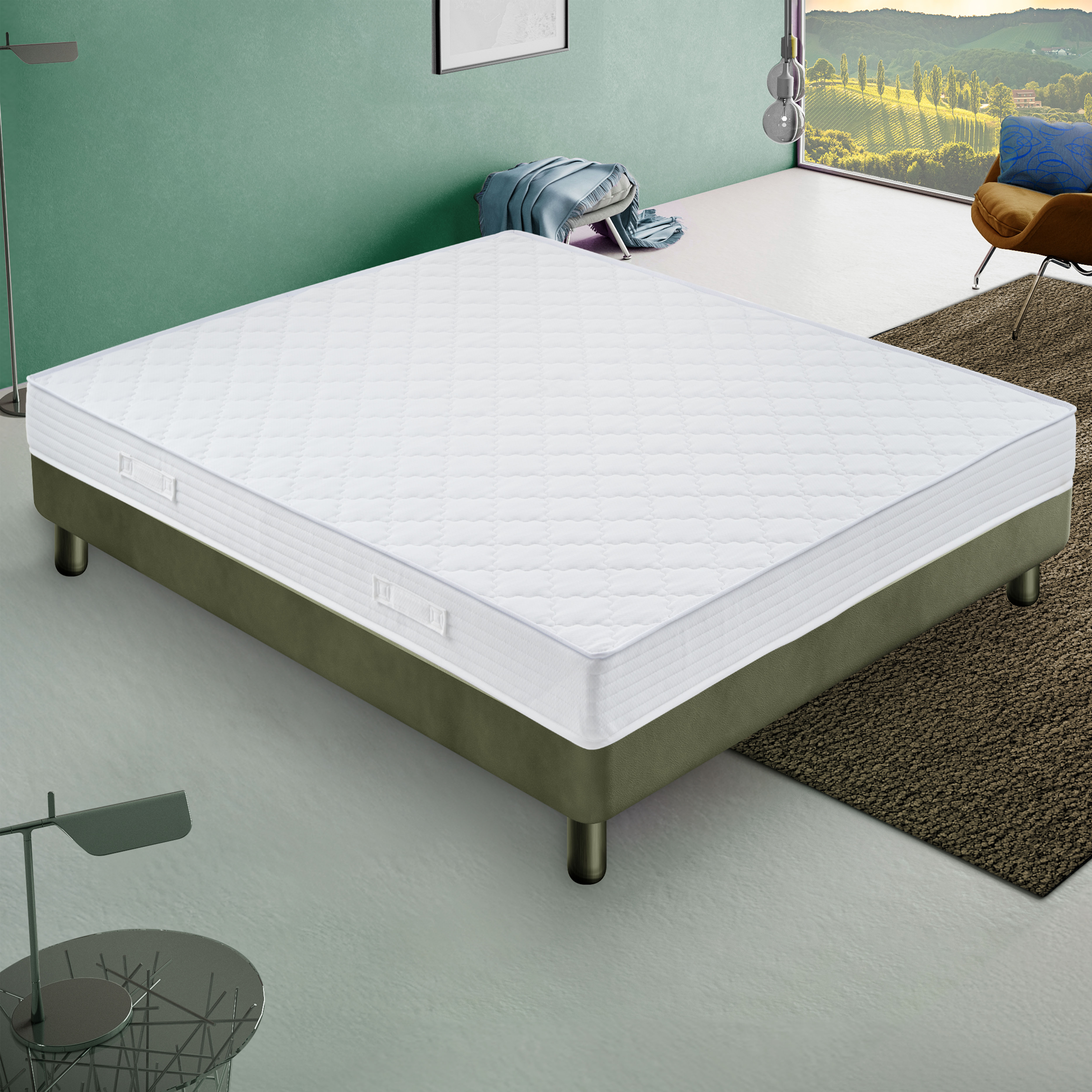 Un colchón blanco con patrón acolchado descansa sobre una base de cama verde.