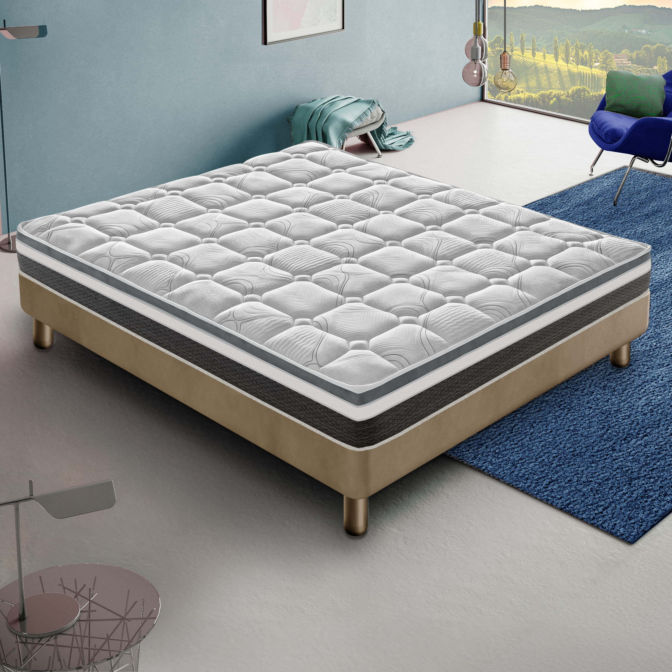 Una cama con colchón blanco, base beige y manta azul frente a una ventana.