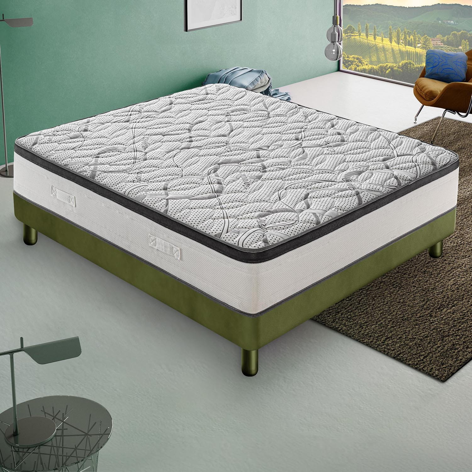 Un colchón blanco y gris sobre un somier verde en un dormitorio moderno.