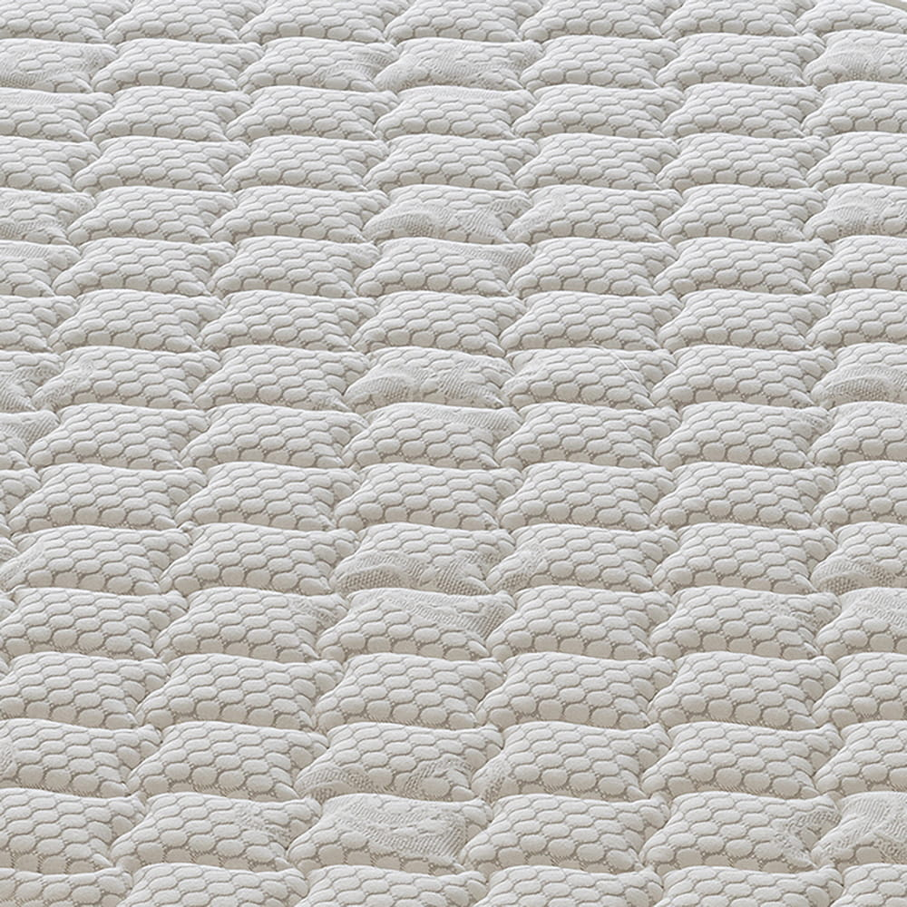 Vista de cerca de una tela blanca texturizada con patrón hexagonal repetitivo.