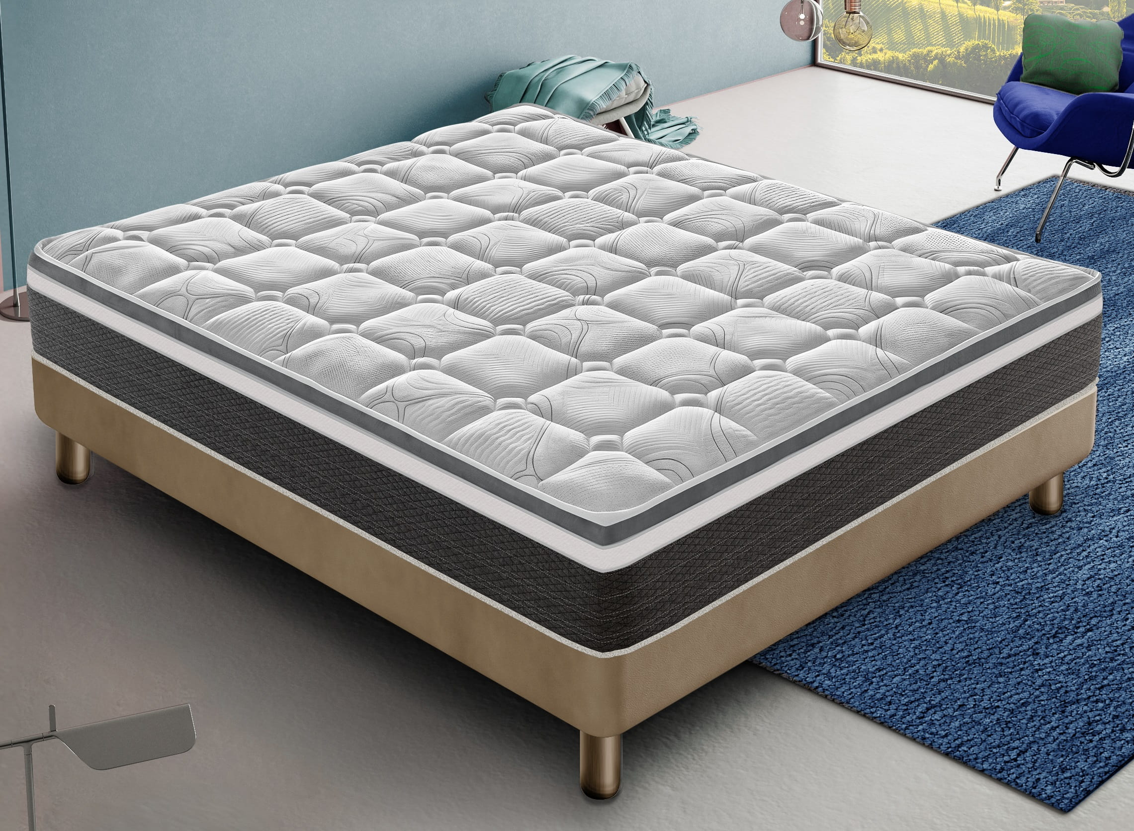 Un colchón blanco y gris acolchado sobre una base beige de cuatro patas.