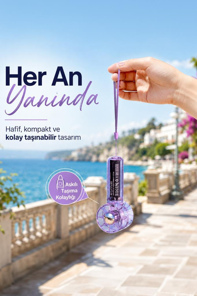 Bir el, mor renkli, askılı bir vantilatörü tutuyor.