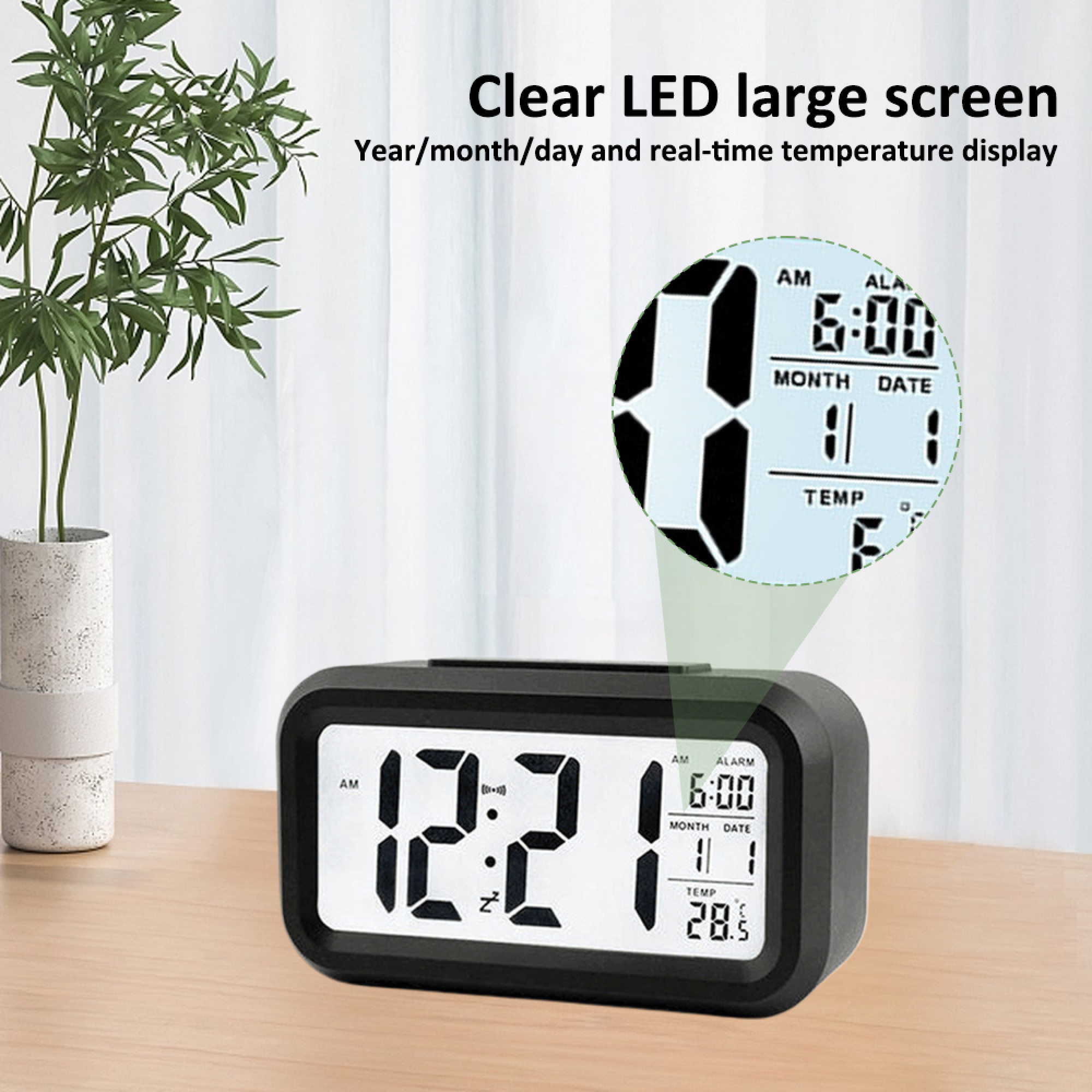 Digitaler Wecker zeigt 12:21 Uhr, Alarm 6:00 Uhr, Datum 11/1, Temp 28.5°C.