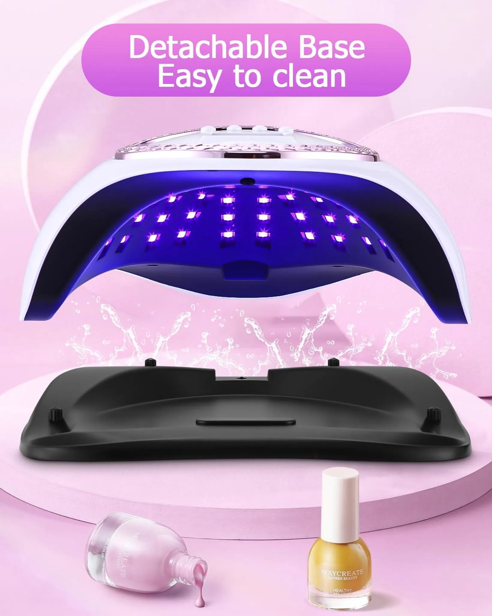 Ein UV-Nageltrockner mit abnehmbarer Basis, daneben zwei Nagellackflaschen.