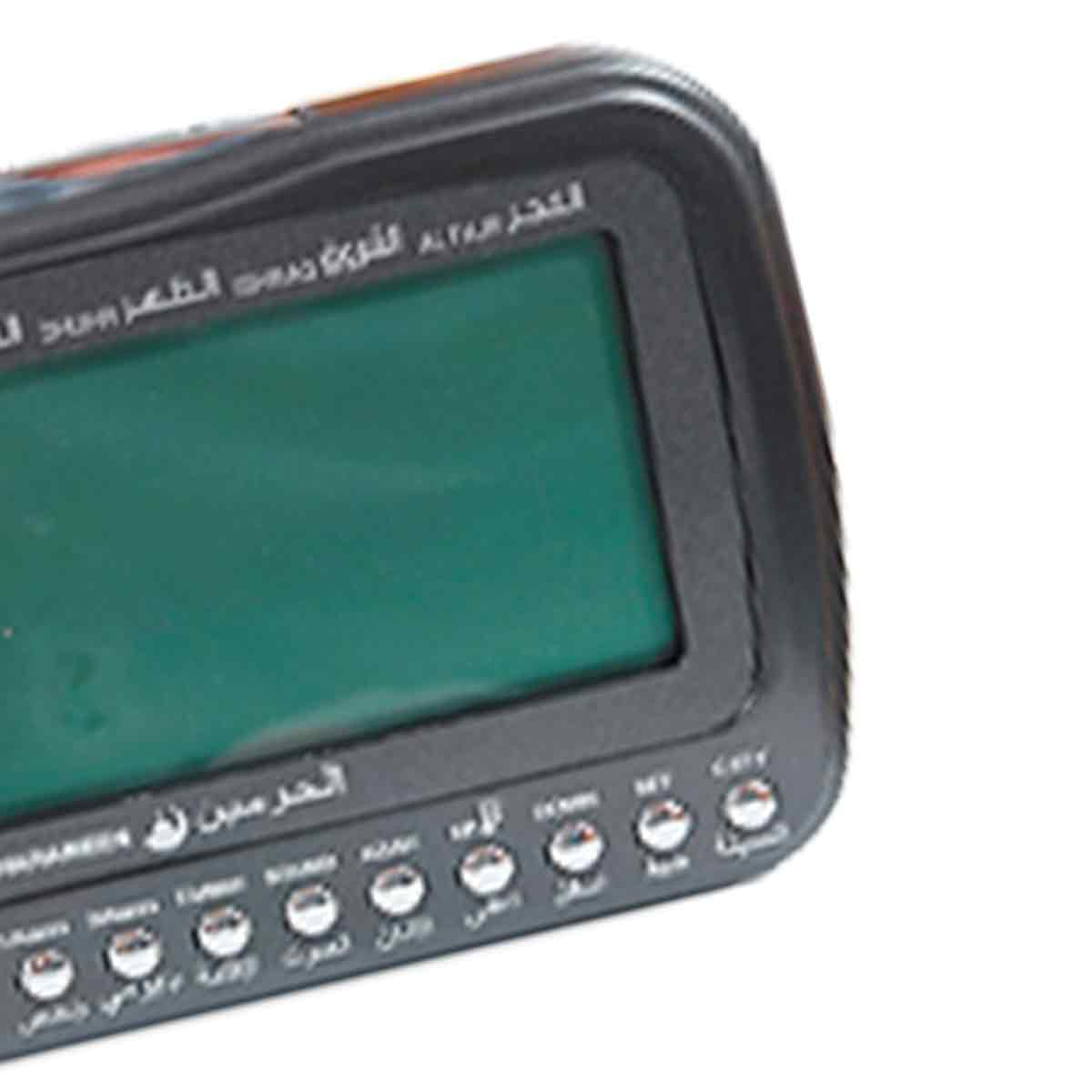 Ein schwarzer digitaler Gebetsführer mit einem grünen Bildschirm und arabischen Tasten.