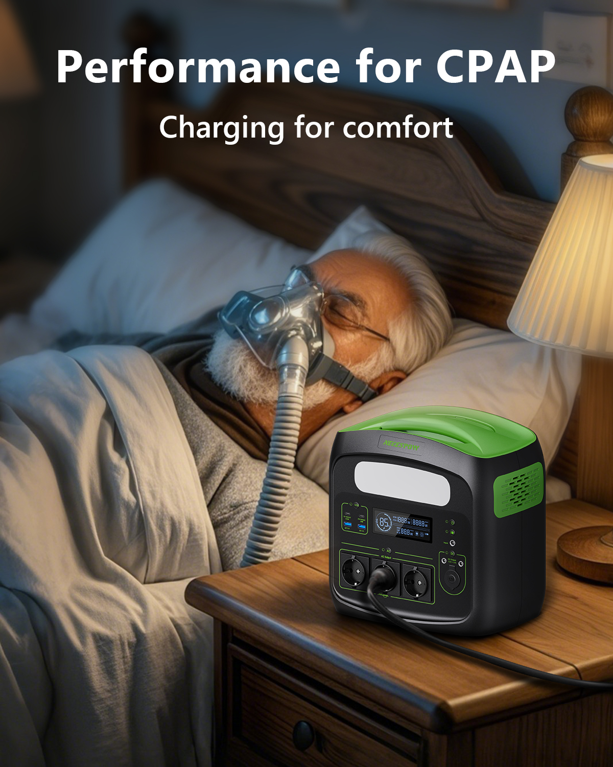 Un hombre duerme con mascarilla CPAP, una estación de energía portátil en la mesita.