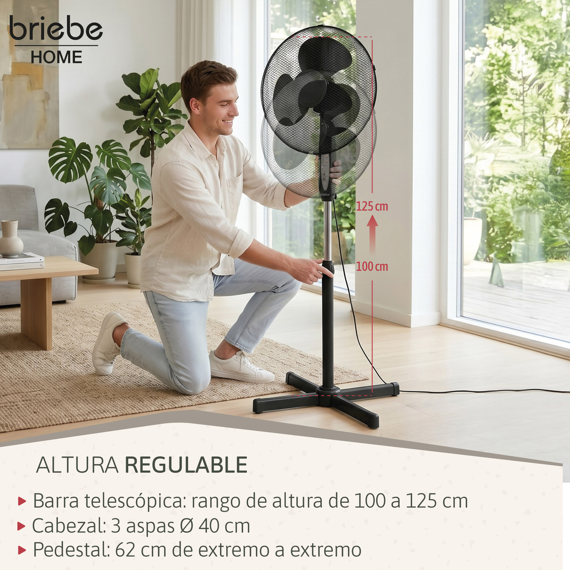Hombre arrodillado junto a un ventilador de pie negro regulable en altura.