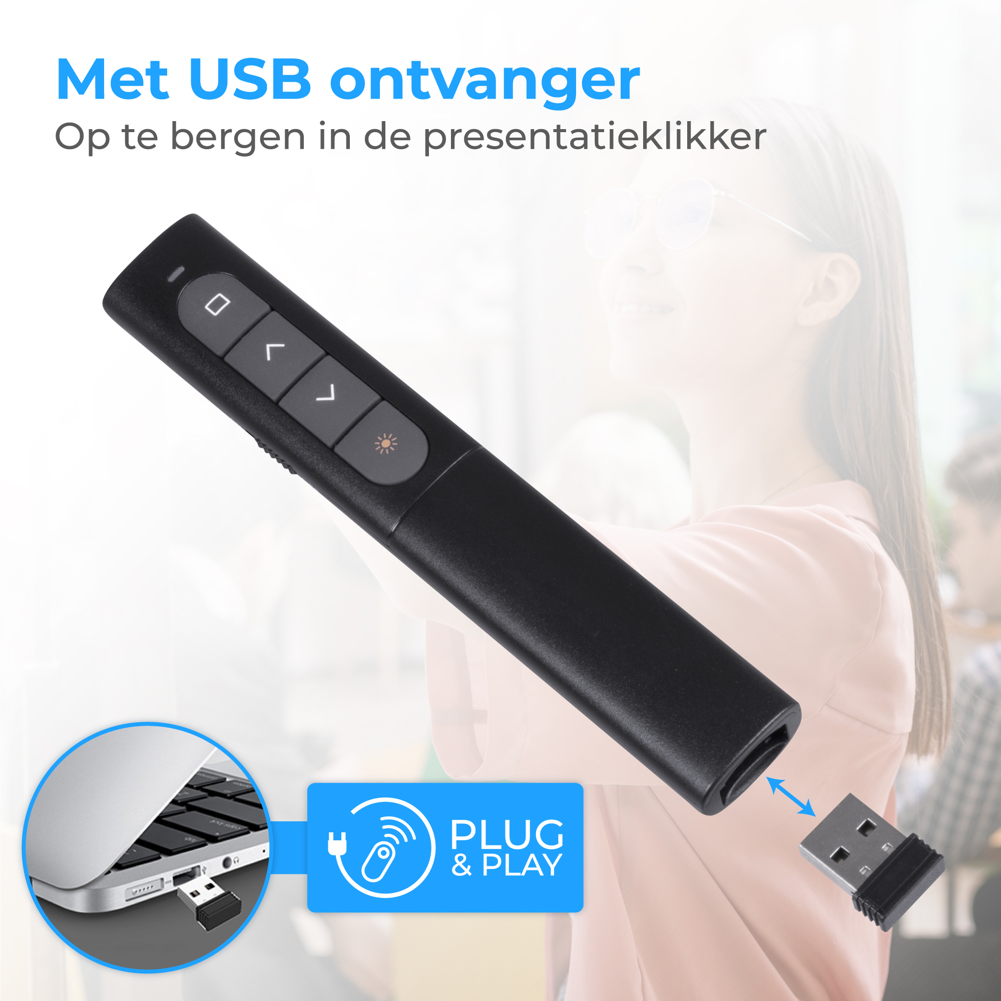 Zwarte presentatieklikker met USB-ontvanger en laptop toetsenbord.