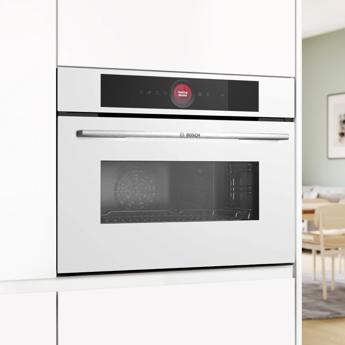 Moderno forno bianco Bosch con display digitale che mostra 'Modalità Riscaldamento'.