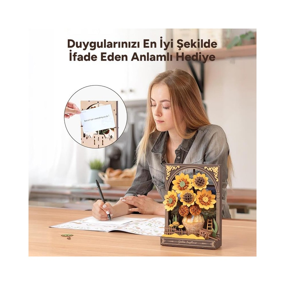 Une jeune femme écrit à un bureau avec un kit de bricolage tournesol et une carte.