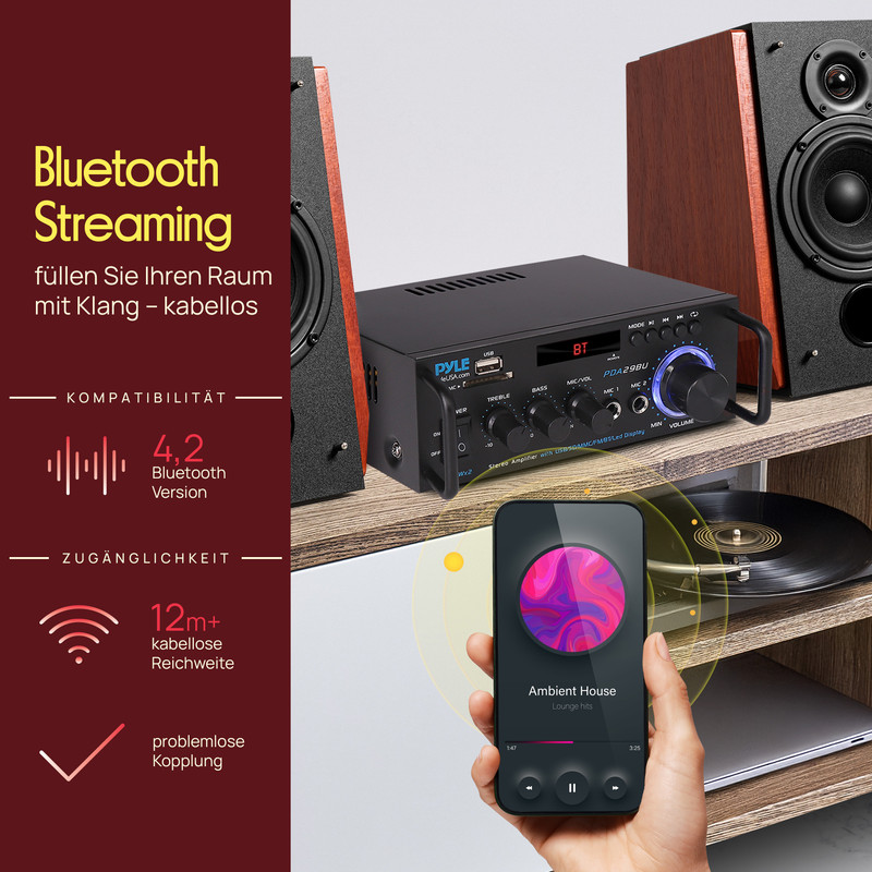 Verstärker mit Smartphone, das Musik abspielt, und Lautsprechern.