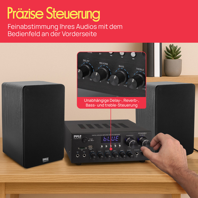 Ein schwarzer Verstärker mit zwei Lautsprechern und Bedienelementen.