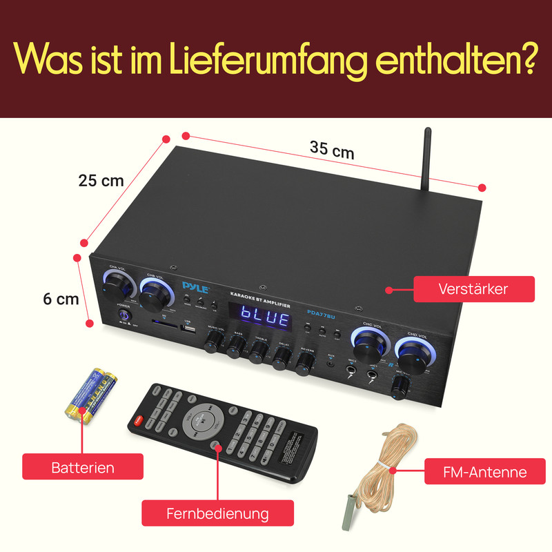Ein schwarzer Verstärker mit Fernbedienung, Batterien und FM-Antenne.