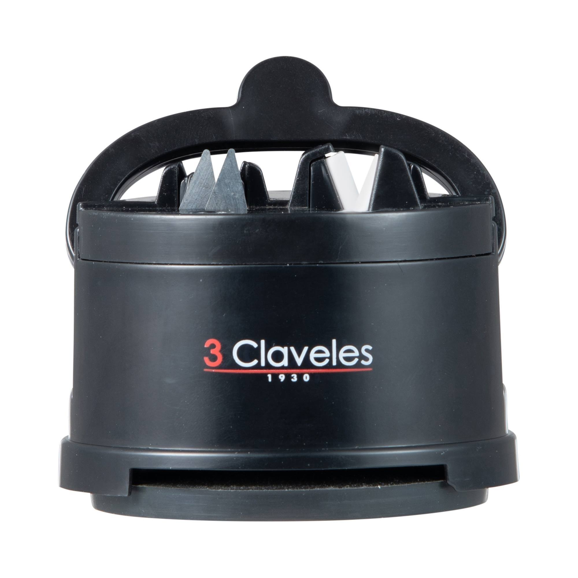 Afilador de cuchillos negro con marcas rojas y blancas.