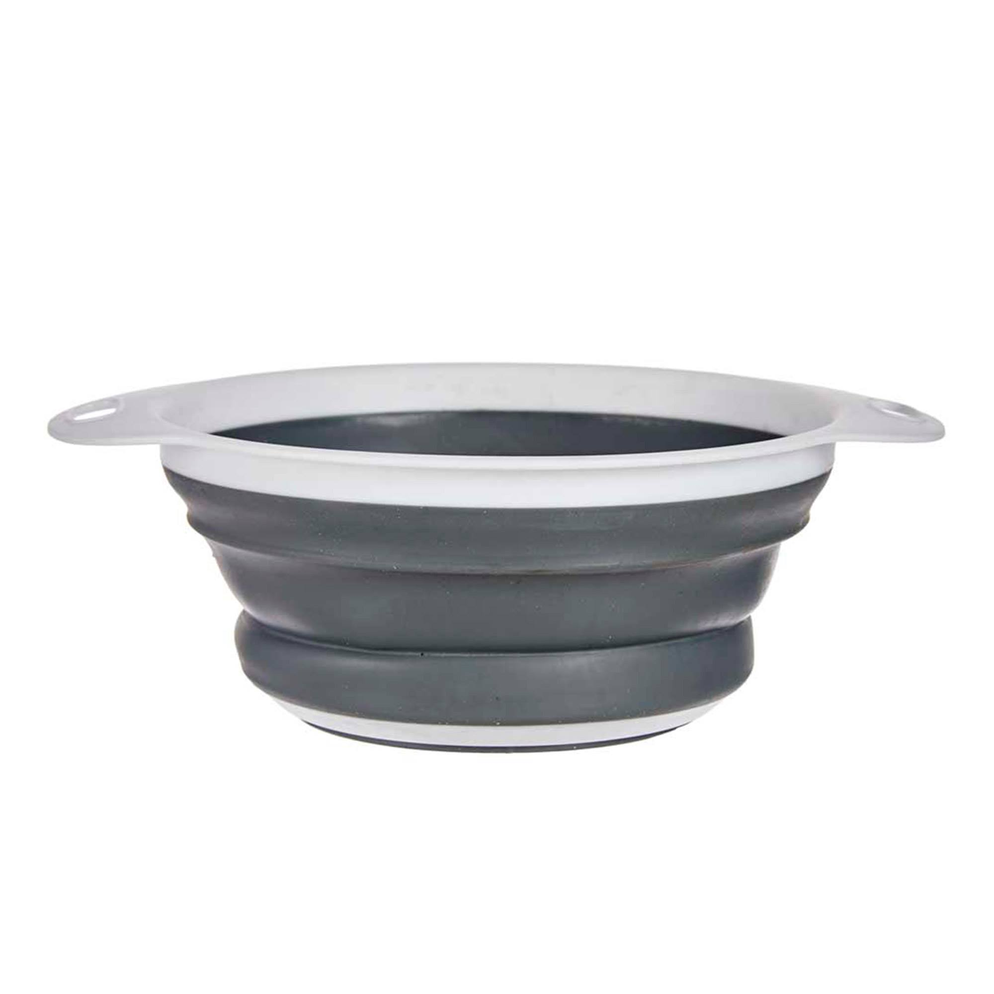 Un cuenco plegable gris con borde blanco y asas.