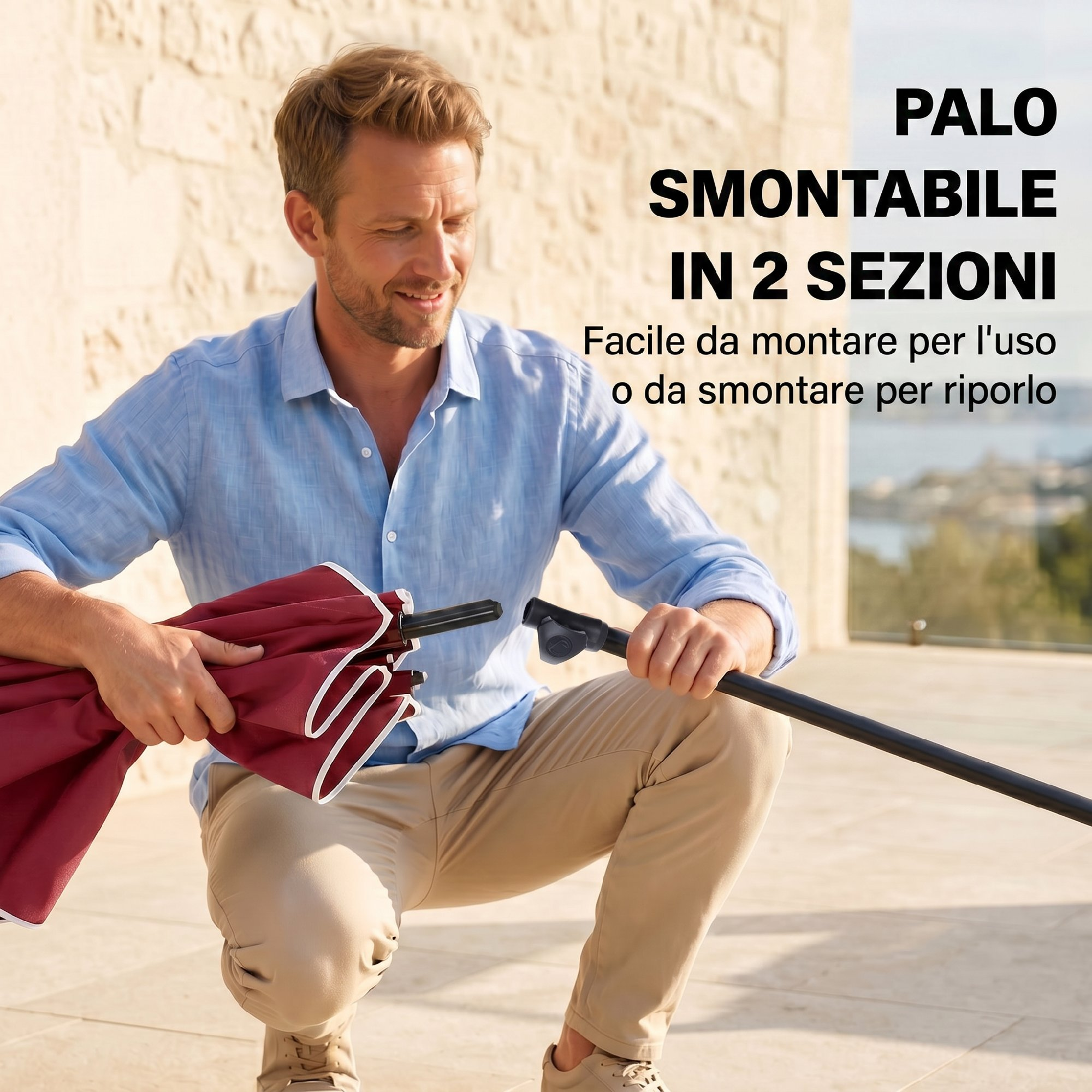 Uomo che monta un ombrello rosso con bordo bianco.