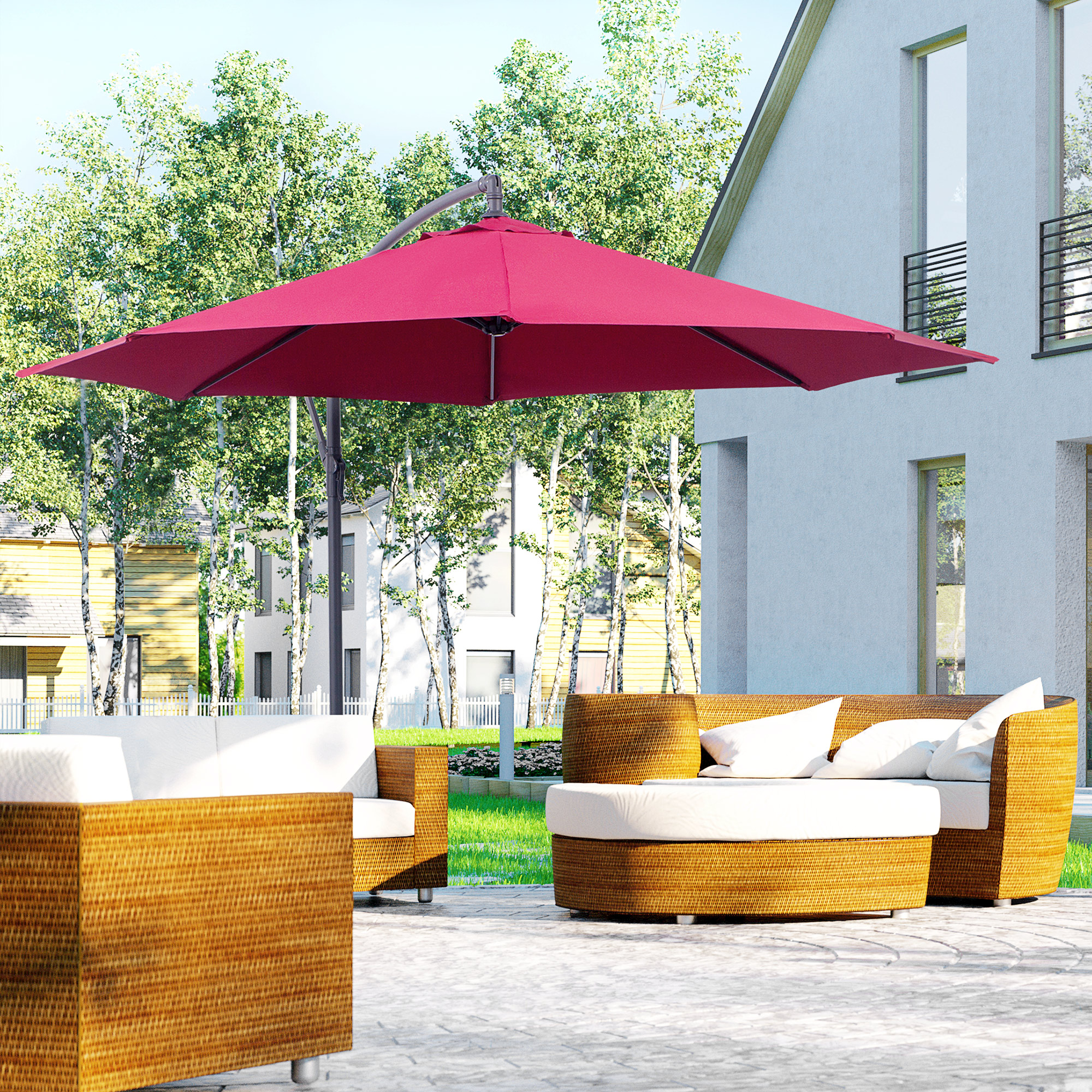 Set di mobili da giardino con ombrellone rosso davanti a una casa.