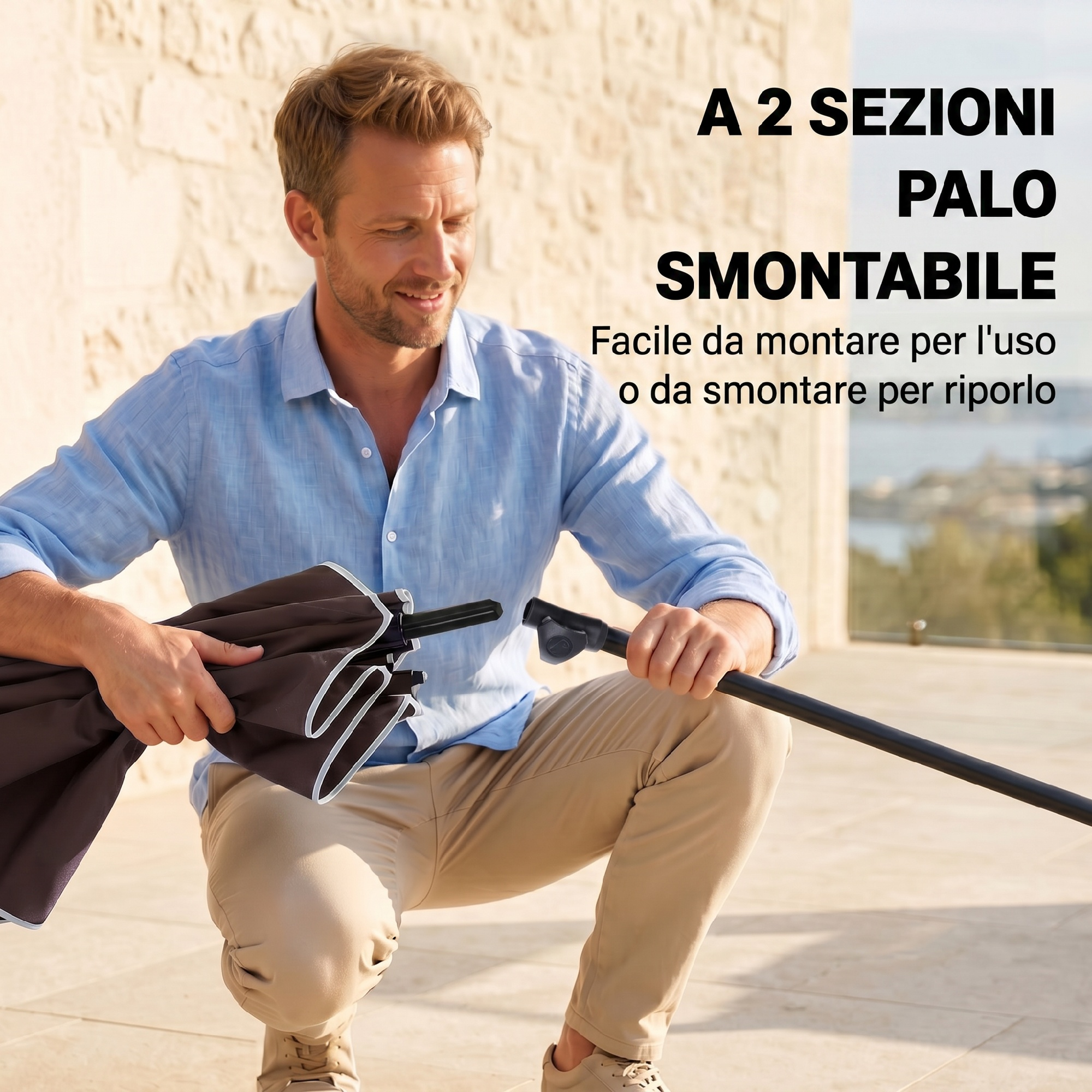 Uomo monta un palo ombrellone smontabile a due sezioni all'aperto.