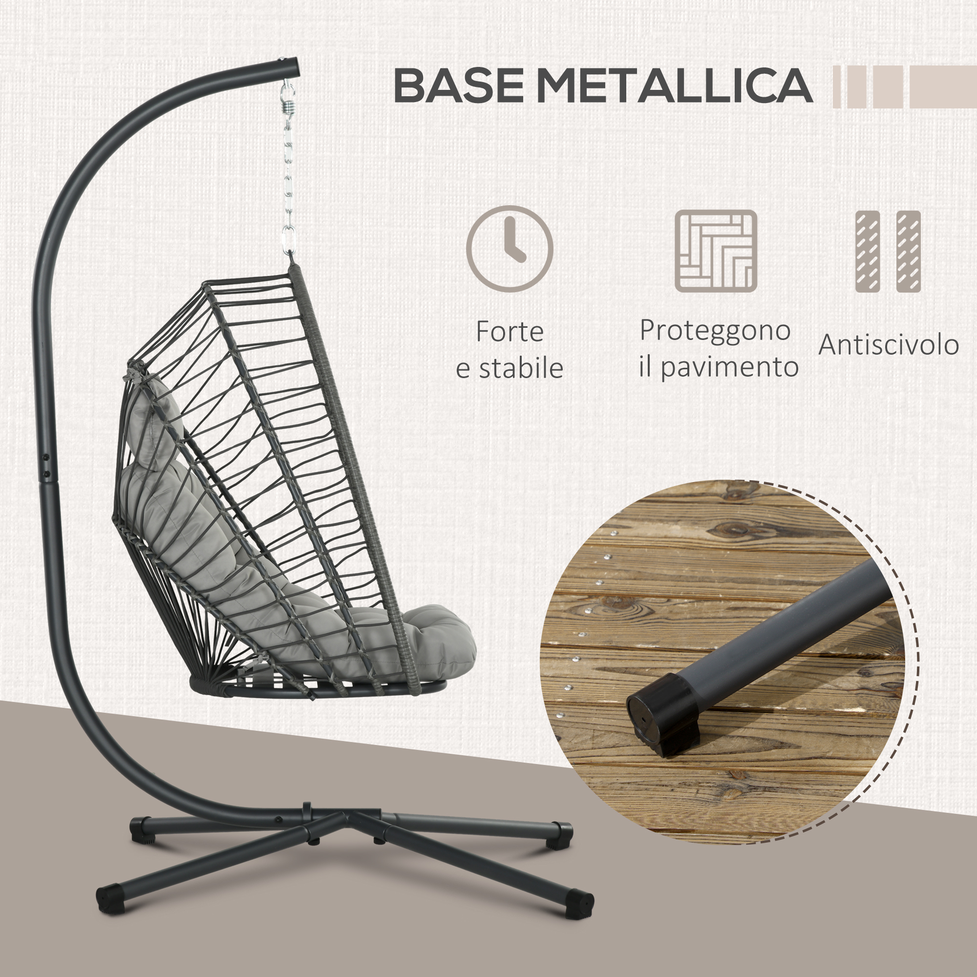 Una sedia a cesto sospesa con cuscini grigi su un supporto metallico scuro.