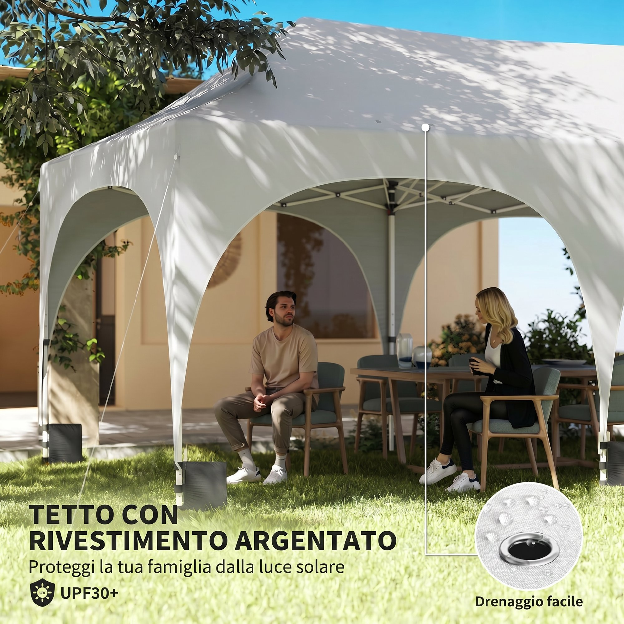 Una coppia siede sotto un gazebo a un tavolo in giardino.