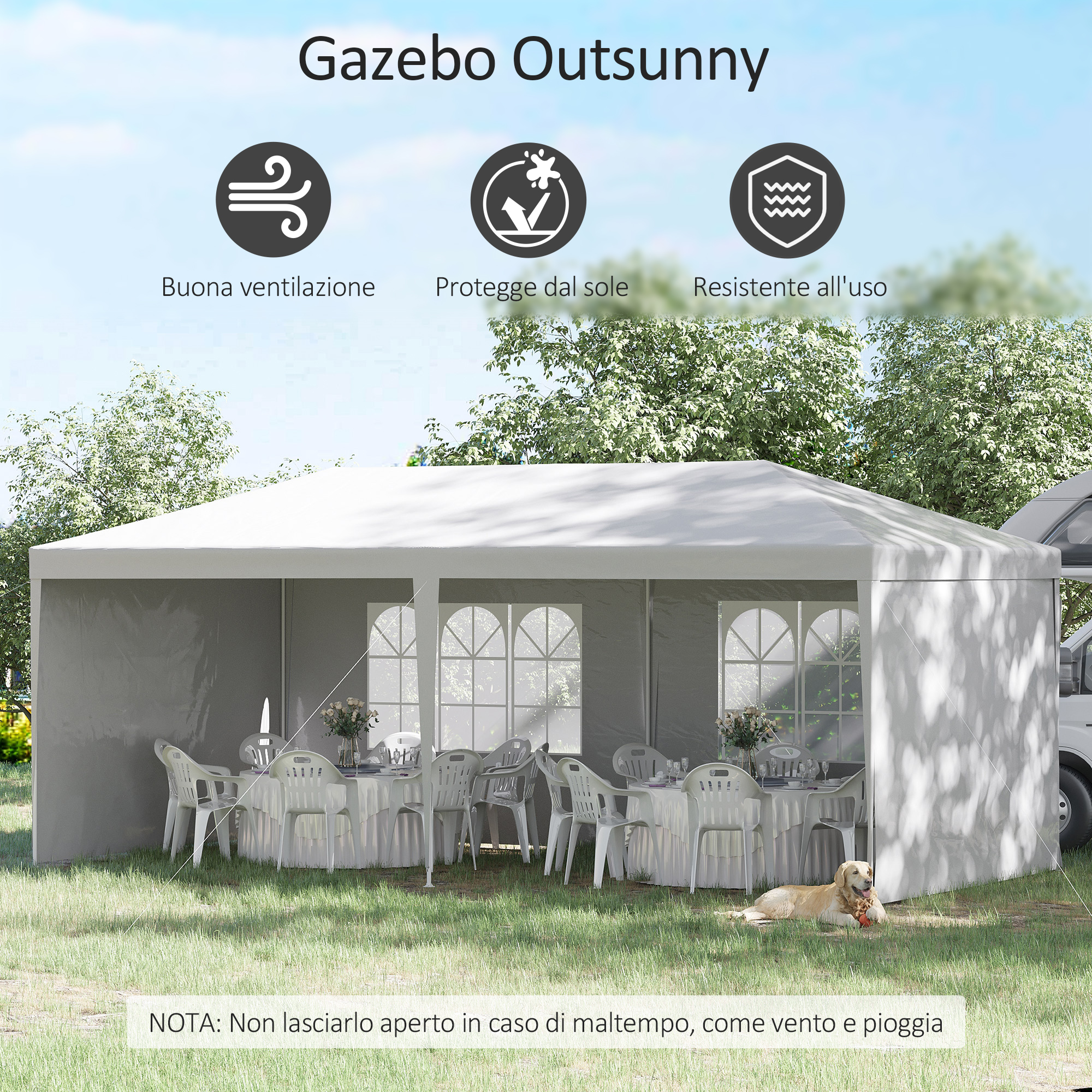 Un gazebo bianco con tavoli, sedie e un cane sull'erba.