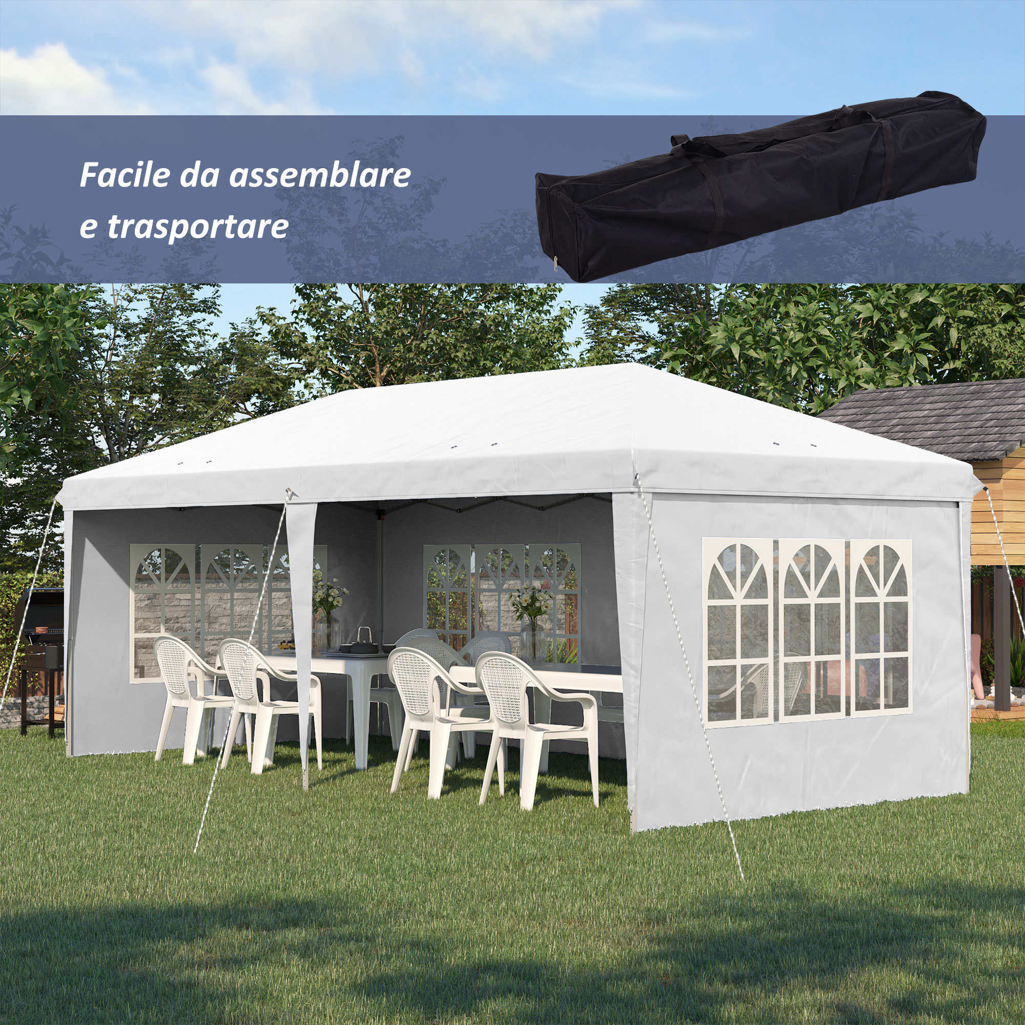 Una tenda bianca con finestre si erge su un prato verde. Sedie e tavolo all'interno.