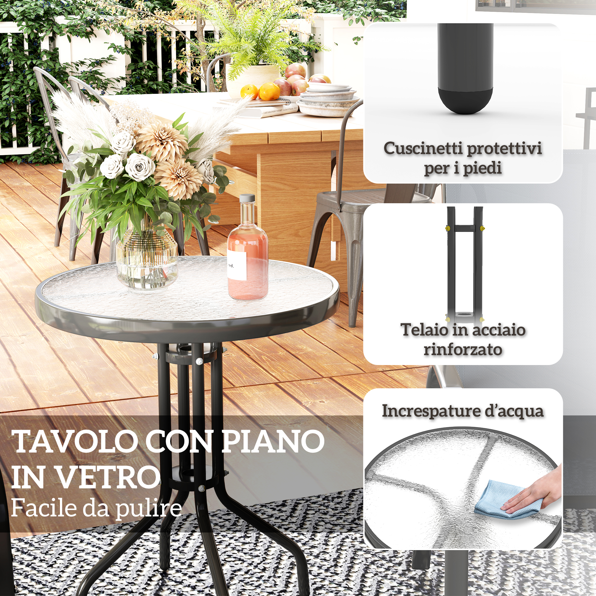 Tavolo rotondo con piano in vetro e gambe in metallo nero su terrazza in legno.