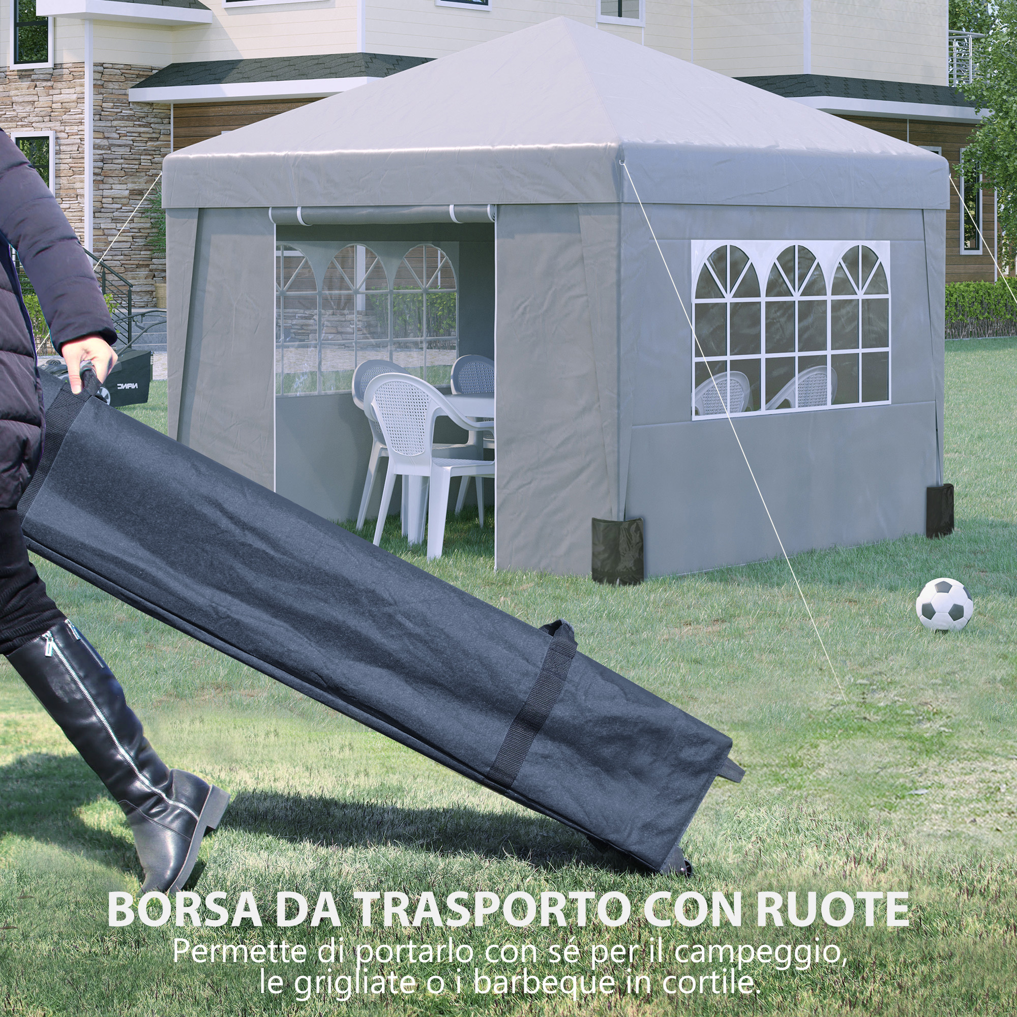 Una persona tira una borsa nera sull'erba davanti a un gazebo.