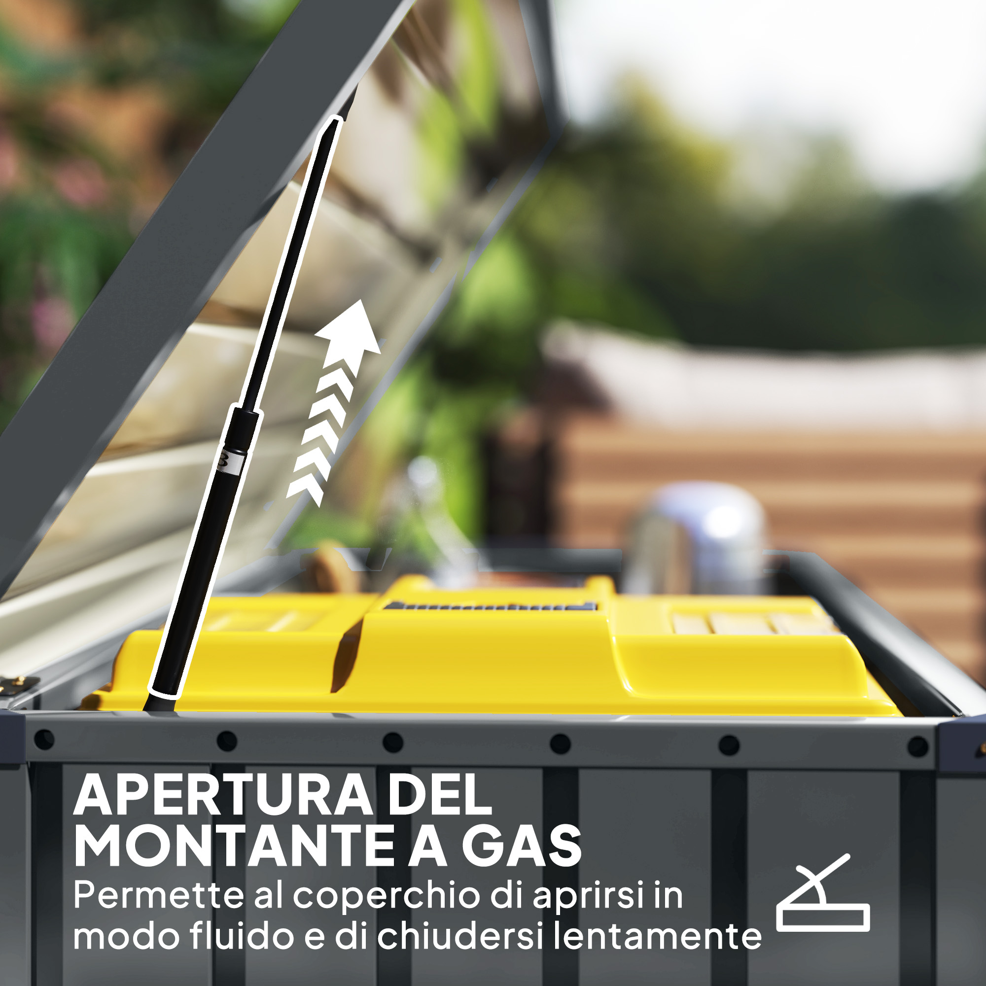 Un ammortizzatore a gas nero apre una scatola grigia con interno giallo.