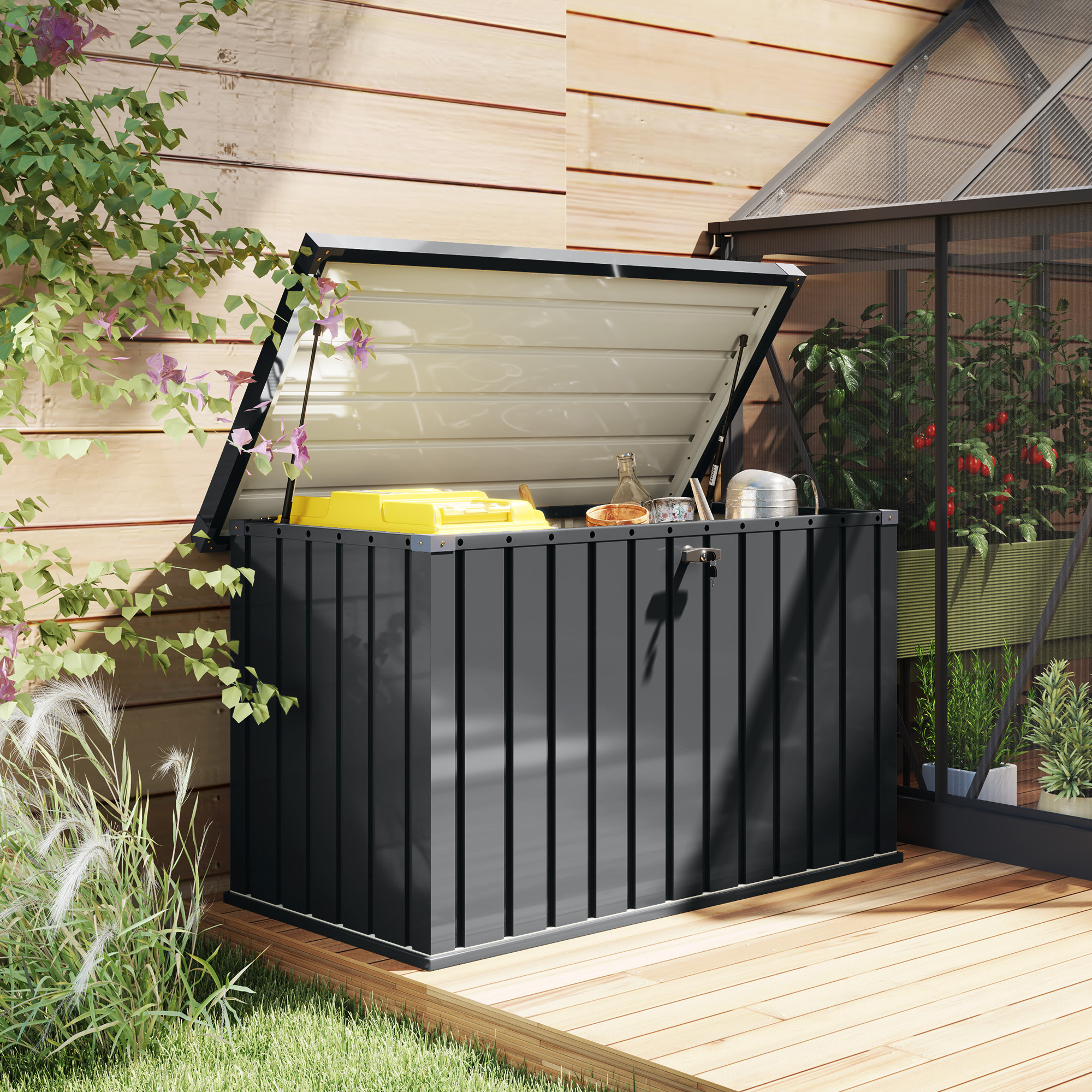 Un box contenitore nero con coperchio aperto, contenente bidoni gialli e grigi e attrezzi da giardino.