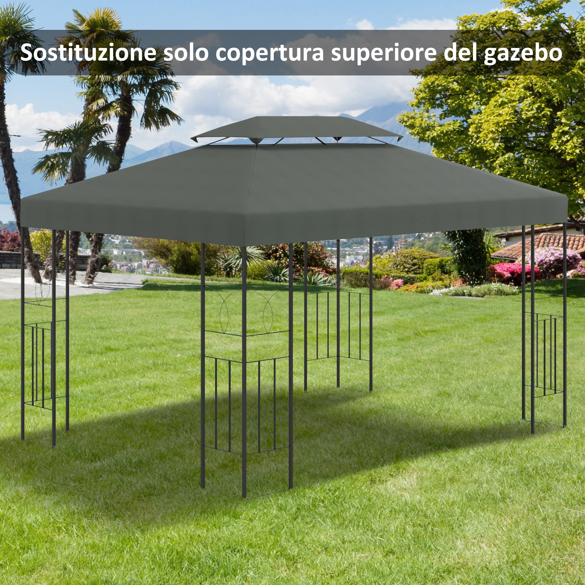 Una copertura superiore grigia per gazebo si erge su un prato davanti ad alberi e montagne.