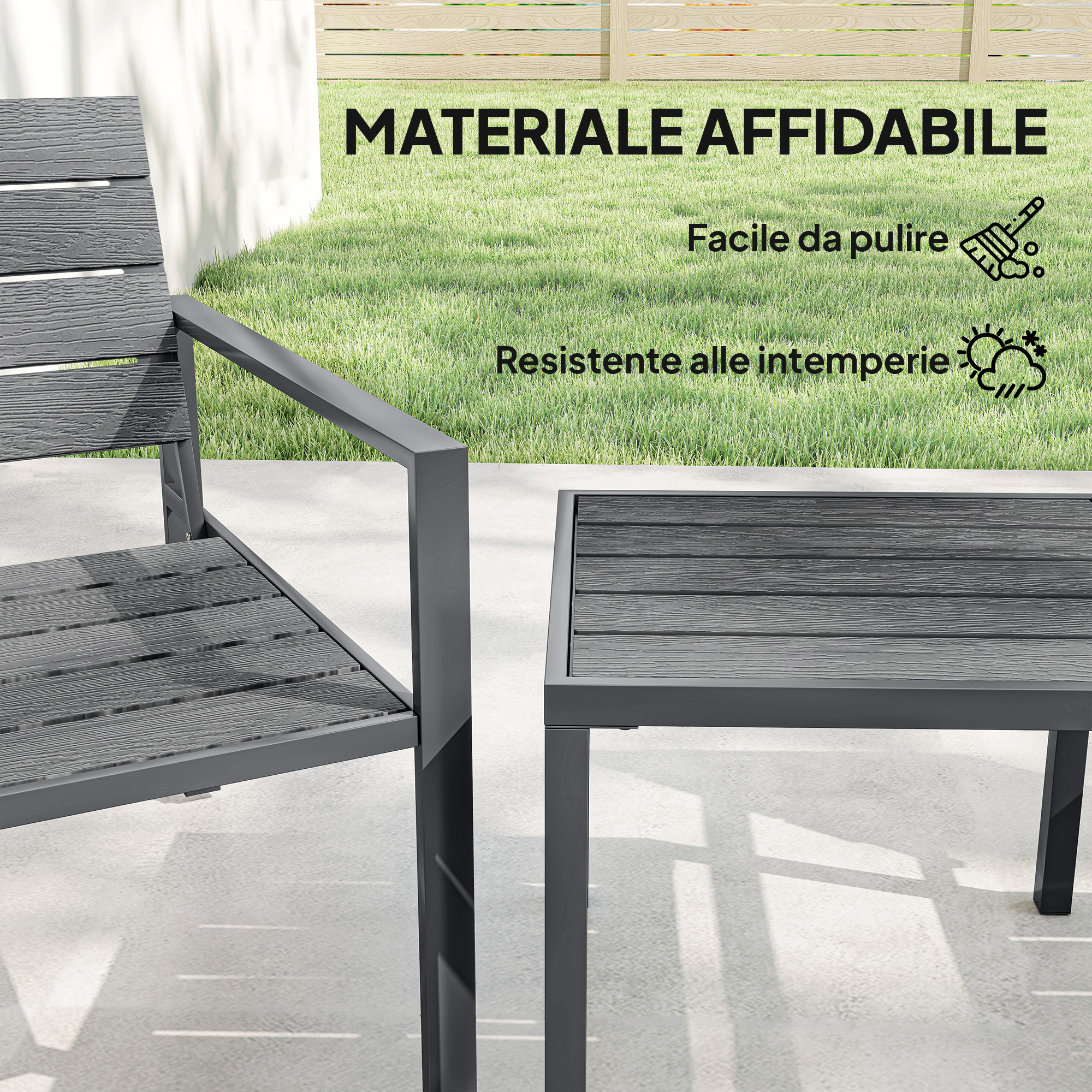 Sedia da esterno grigia e tavolo effetto legno su cemento con erba sullo sfondo.