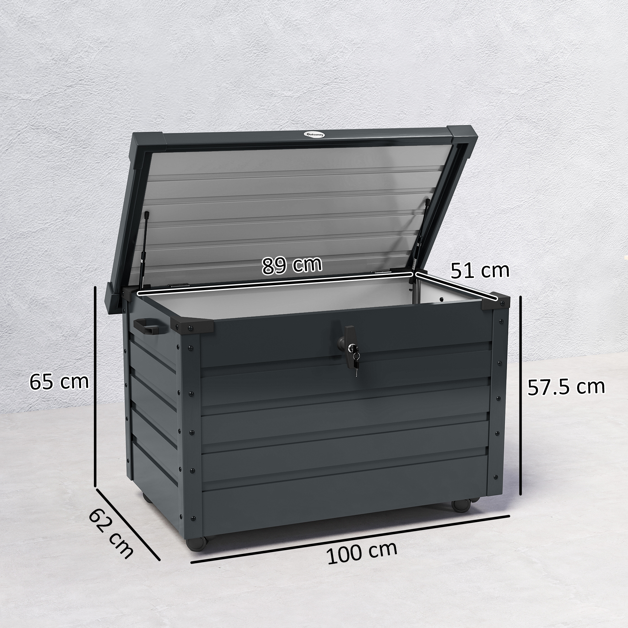 Cassapanca grigio scuro con coperchio aperto, dimensioni indicate. Su ruote.