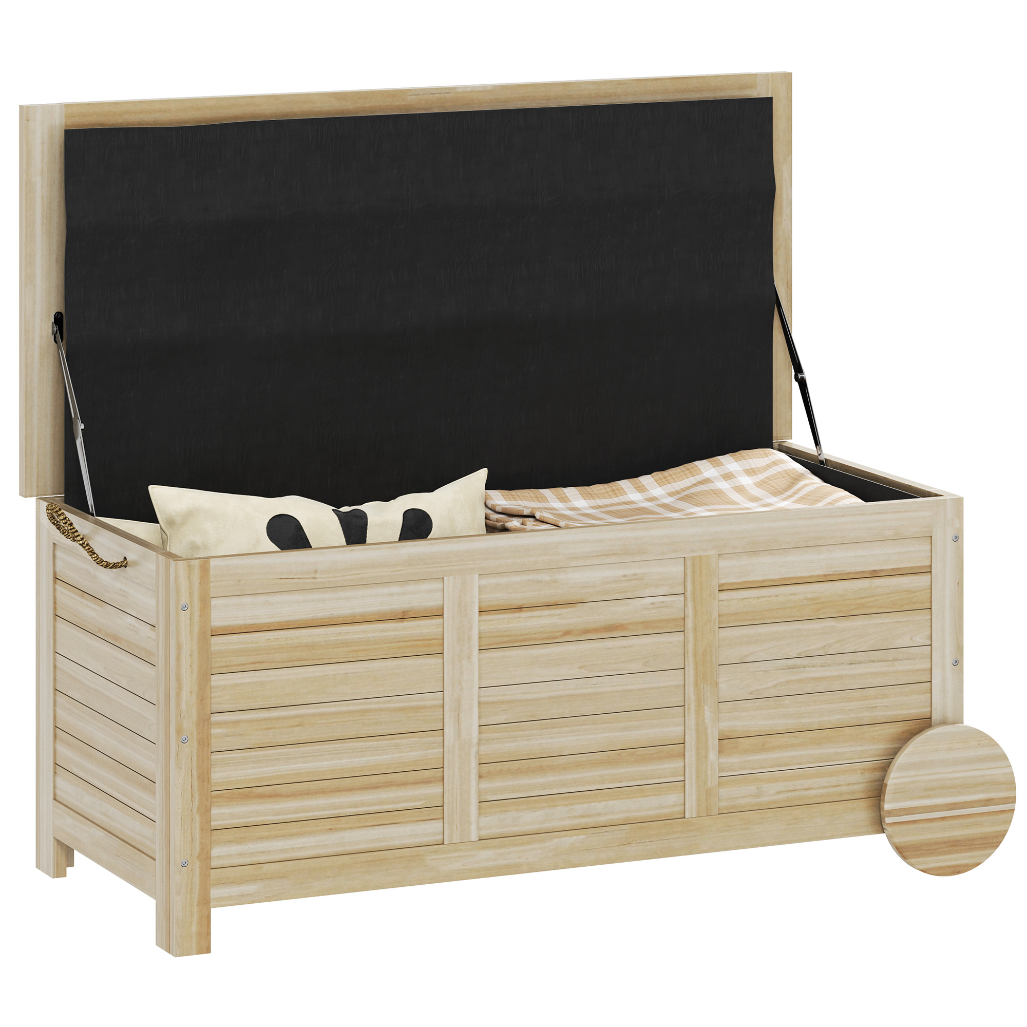 Baúle portaoggetti in legno chiaro aperto con interno nero, cuscino e coperta.