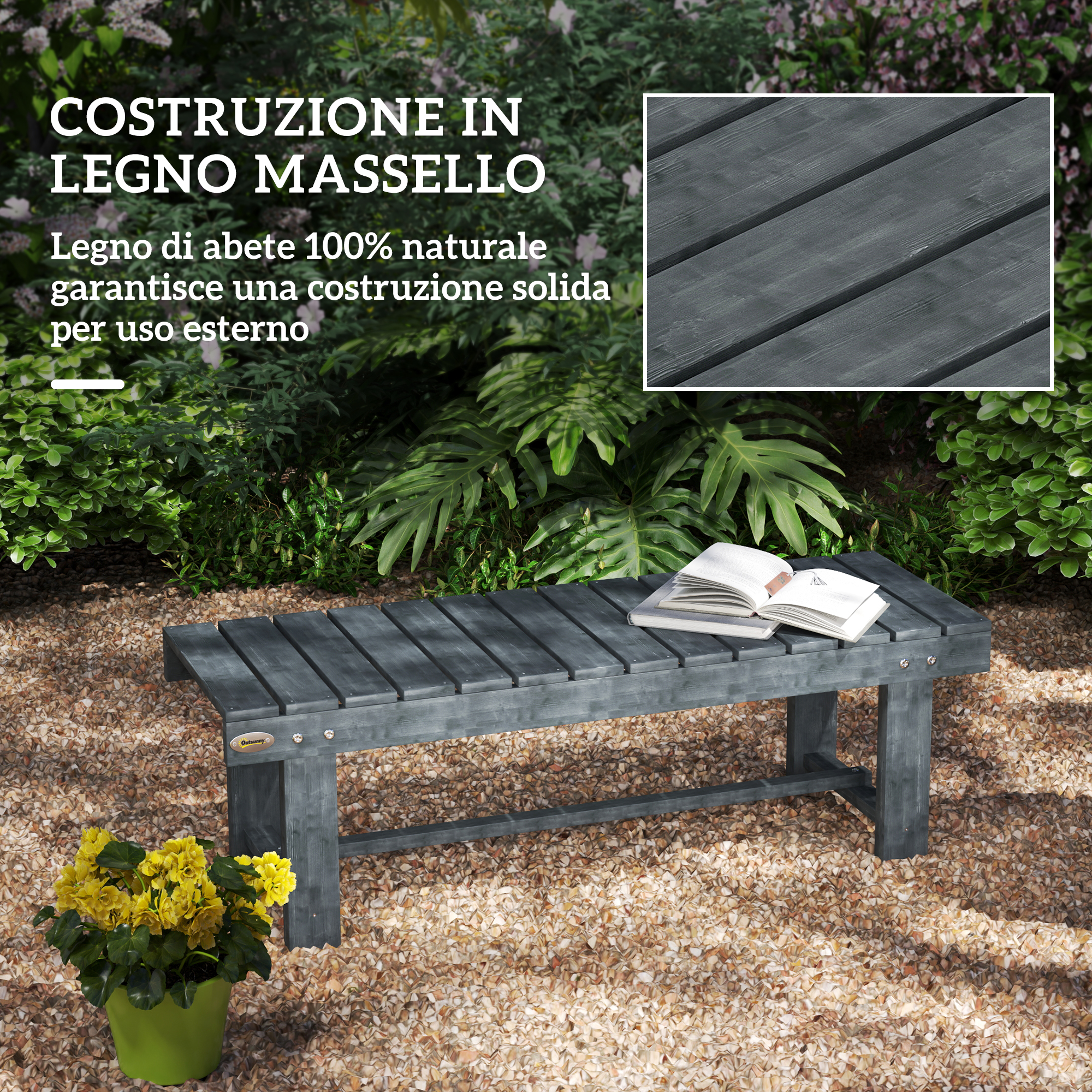 Panca in legno grigio con libri in giardino, su ghiaia e fiori gialli.