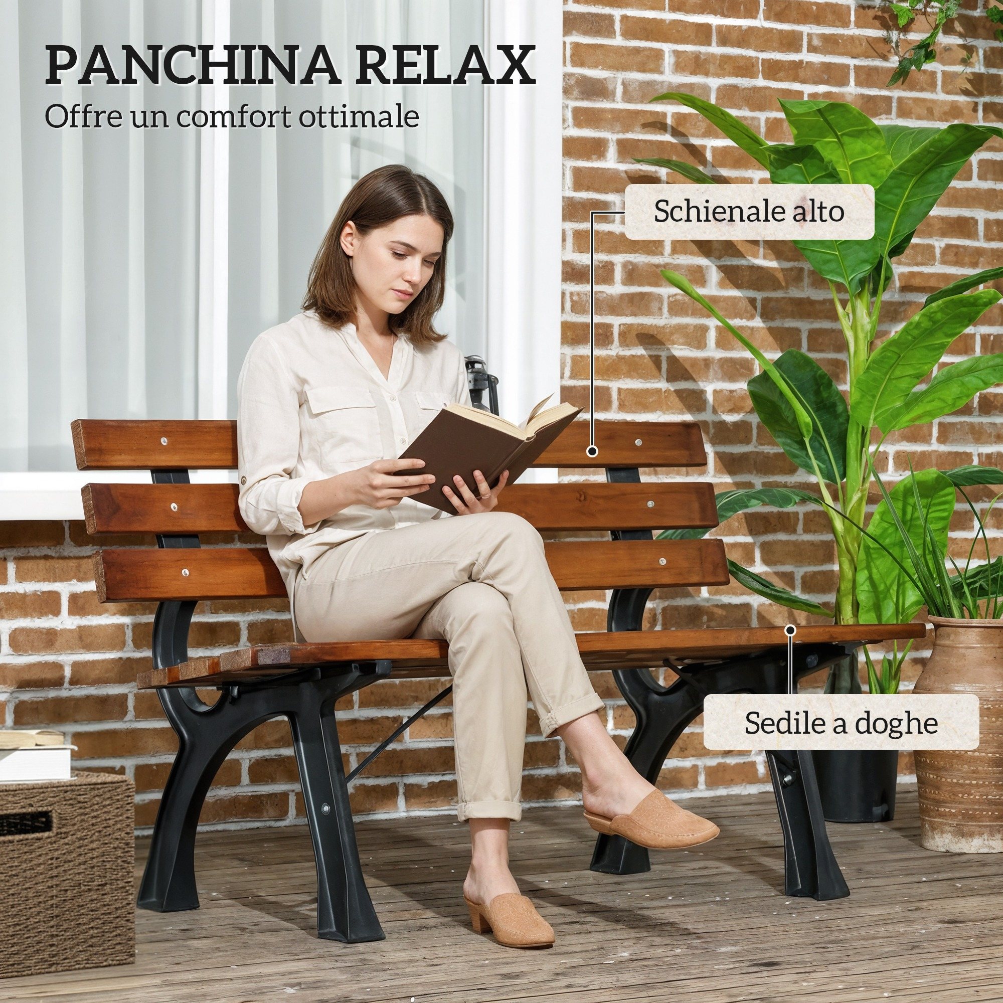 Una donna legge un libro su una panchina di legno davanti a un muro di mattoni.