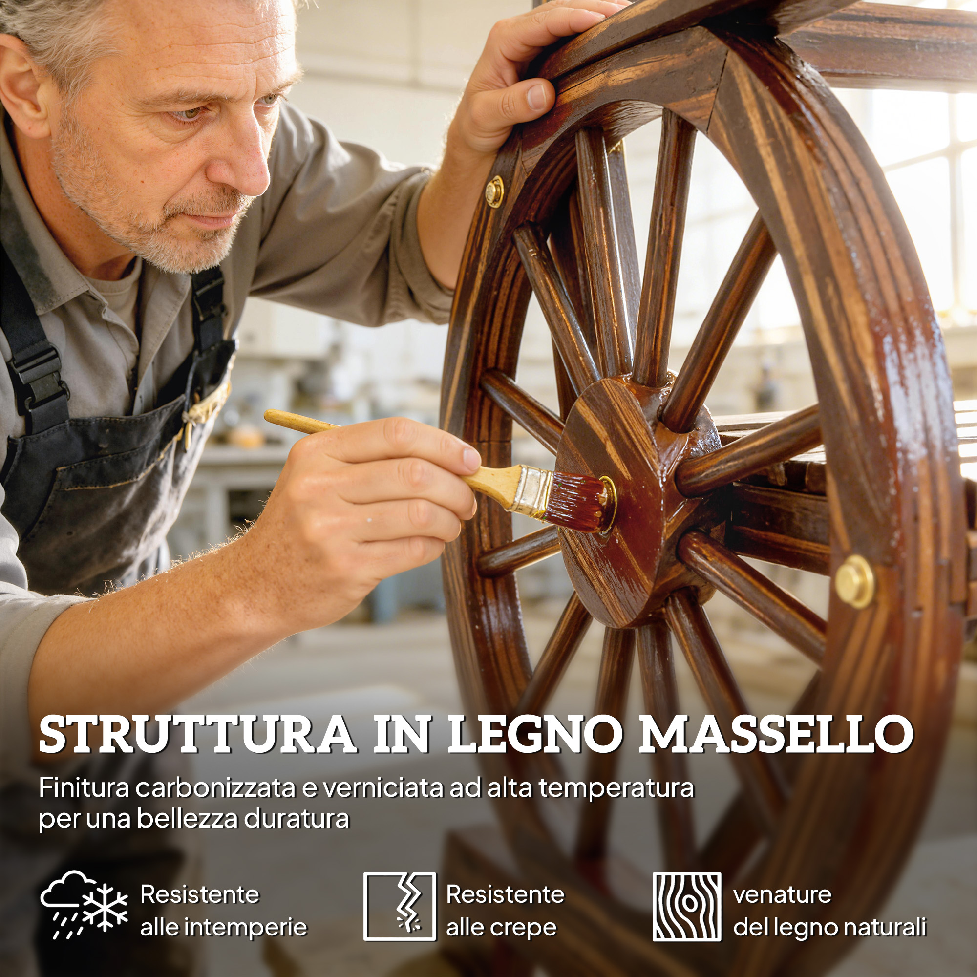 Un uomo applica vernice marrone scuro a una ruota di legno con un pennello.