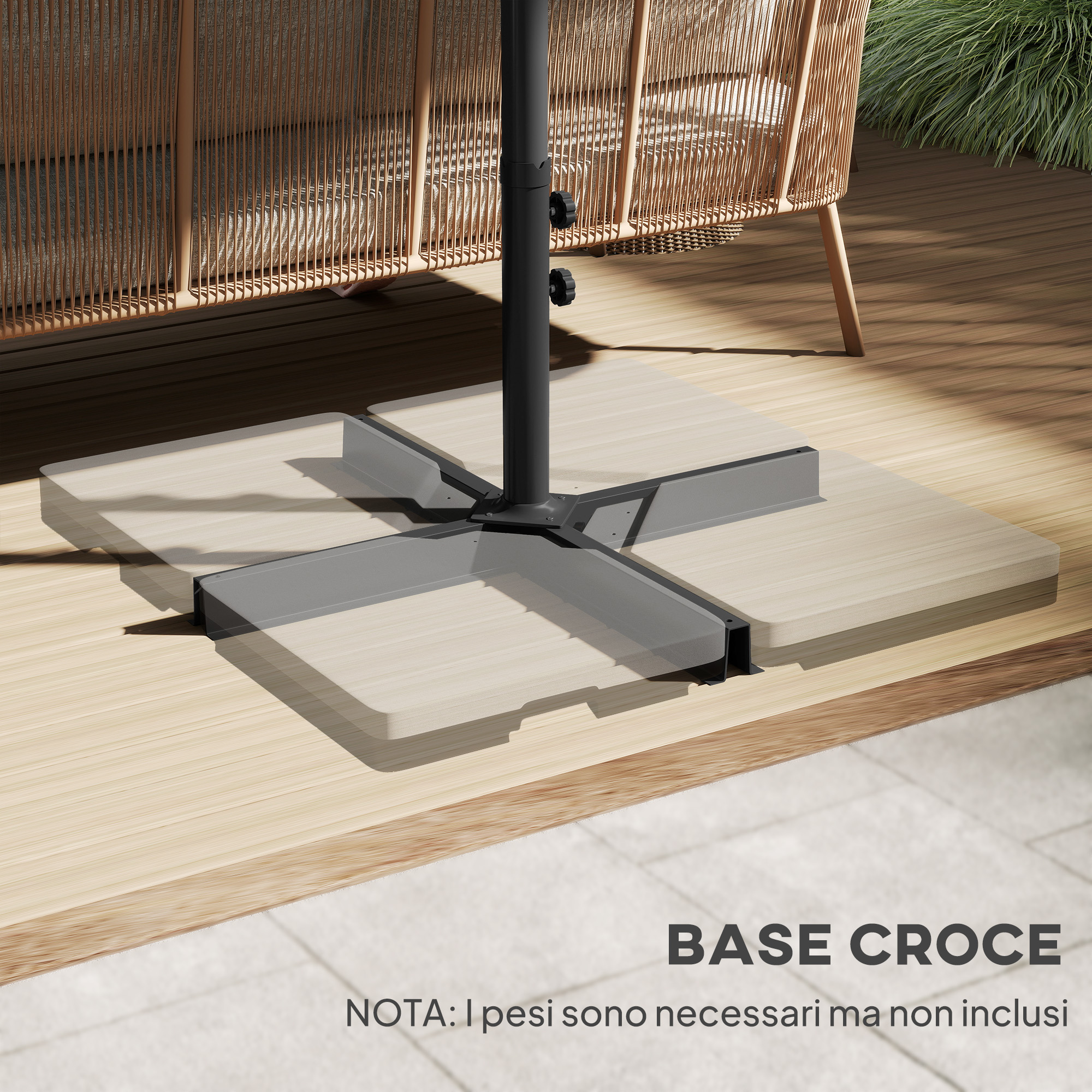 Un portaombrellone nero a forma di croce su un terrazzo in legno accanto a una poltrona in rattan.