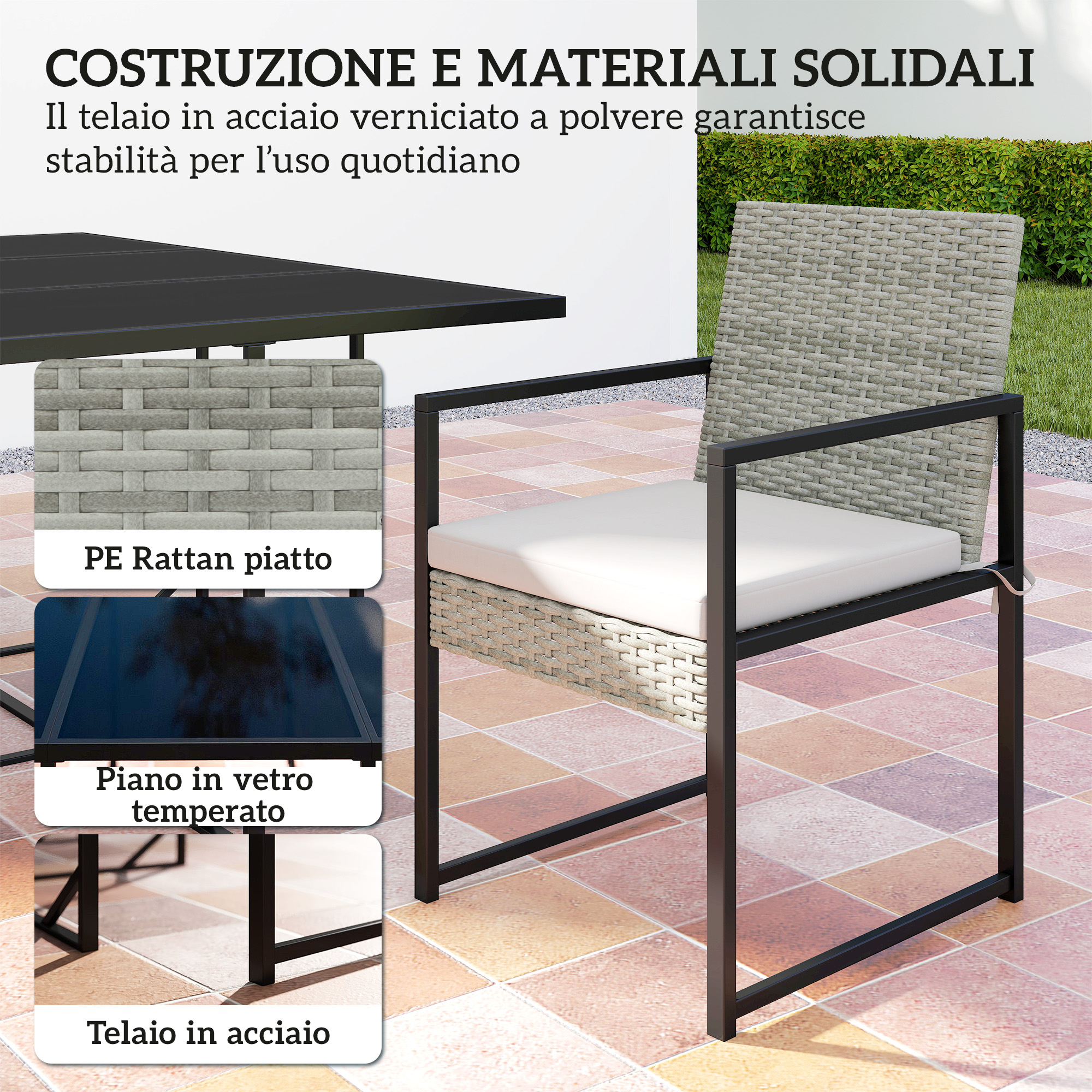Una sedia in rattan grigio con cuscino bianco accanto a un tavolo nero da esterno.