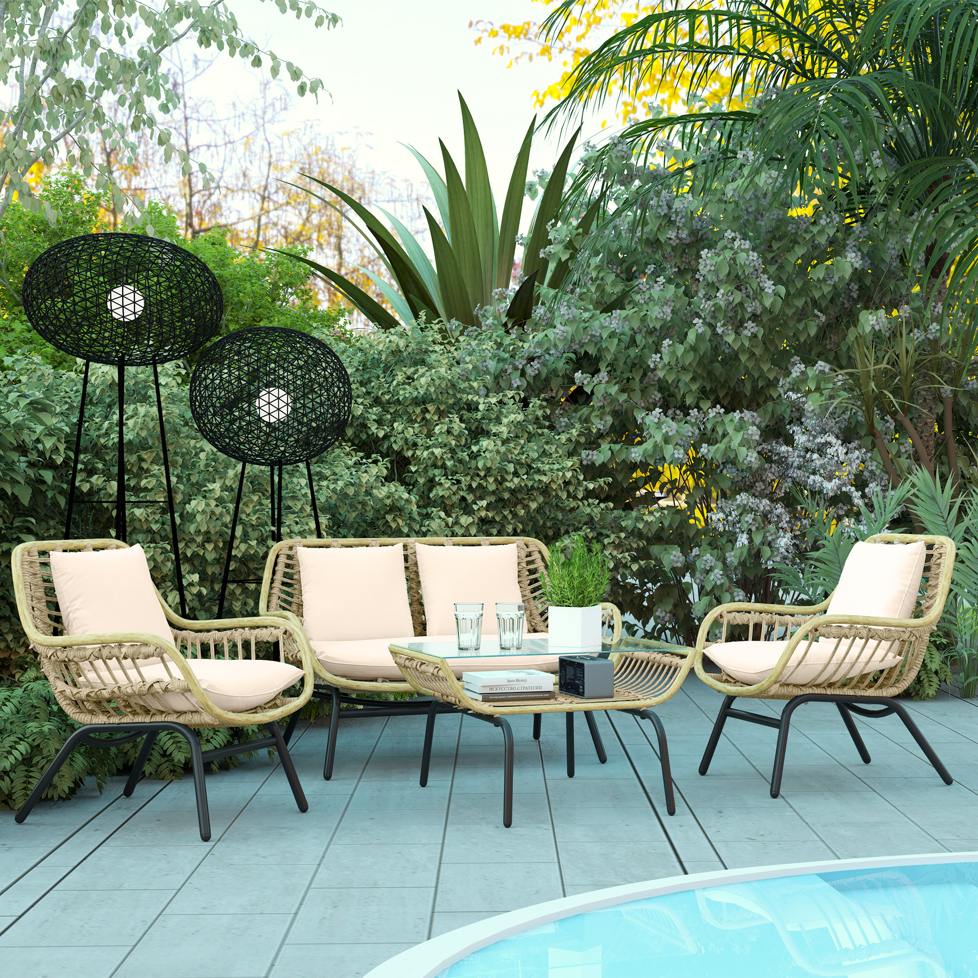 Un set da patio in rattan con due sedie, un divanetto e un tavolino su un patio piastrellato.