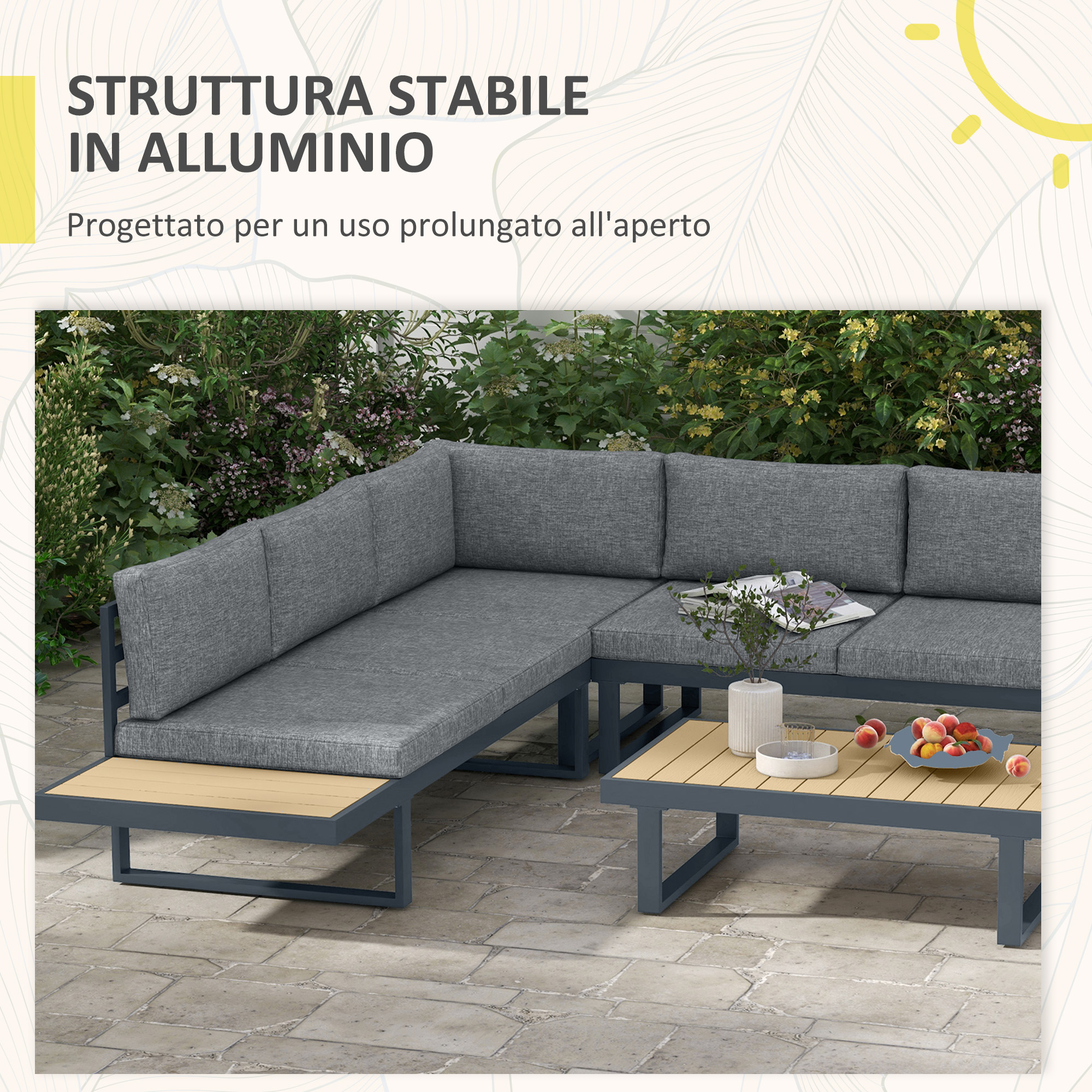 Salotto da giardino grigio su patio in pietra con pesche e libro sul tavolo.