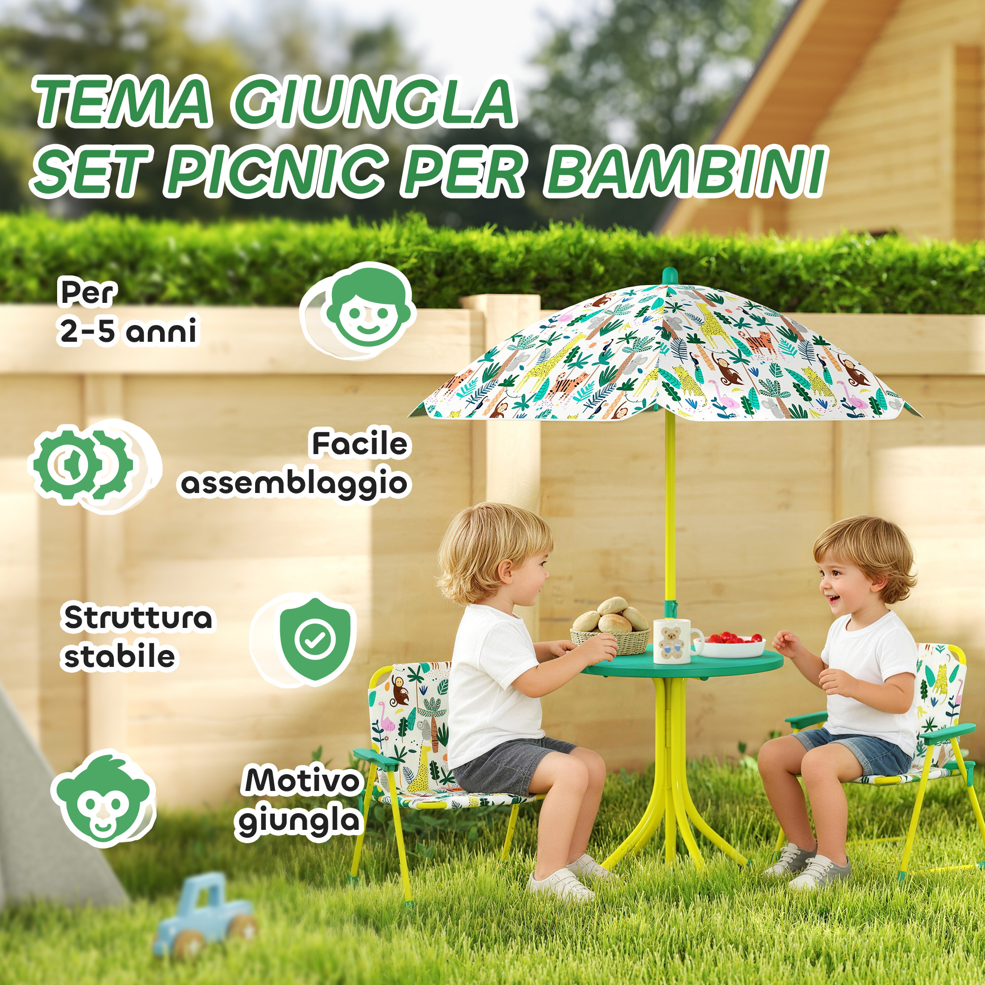 Due bambini siedono a un tavolo da picnic a tema giungla all'aperto.